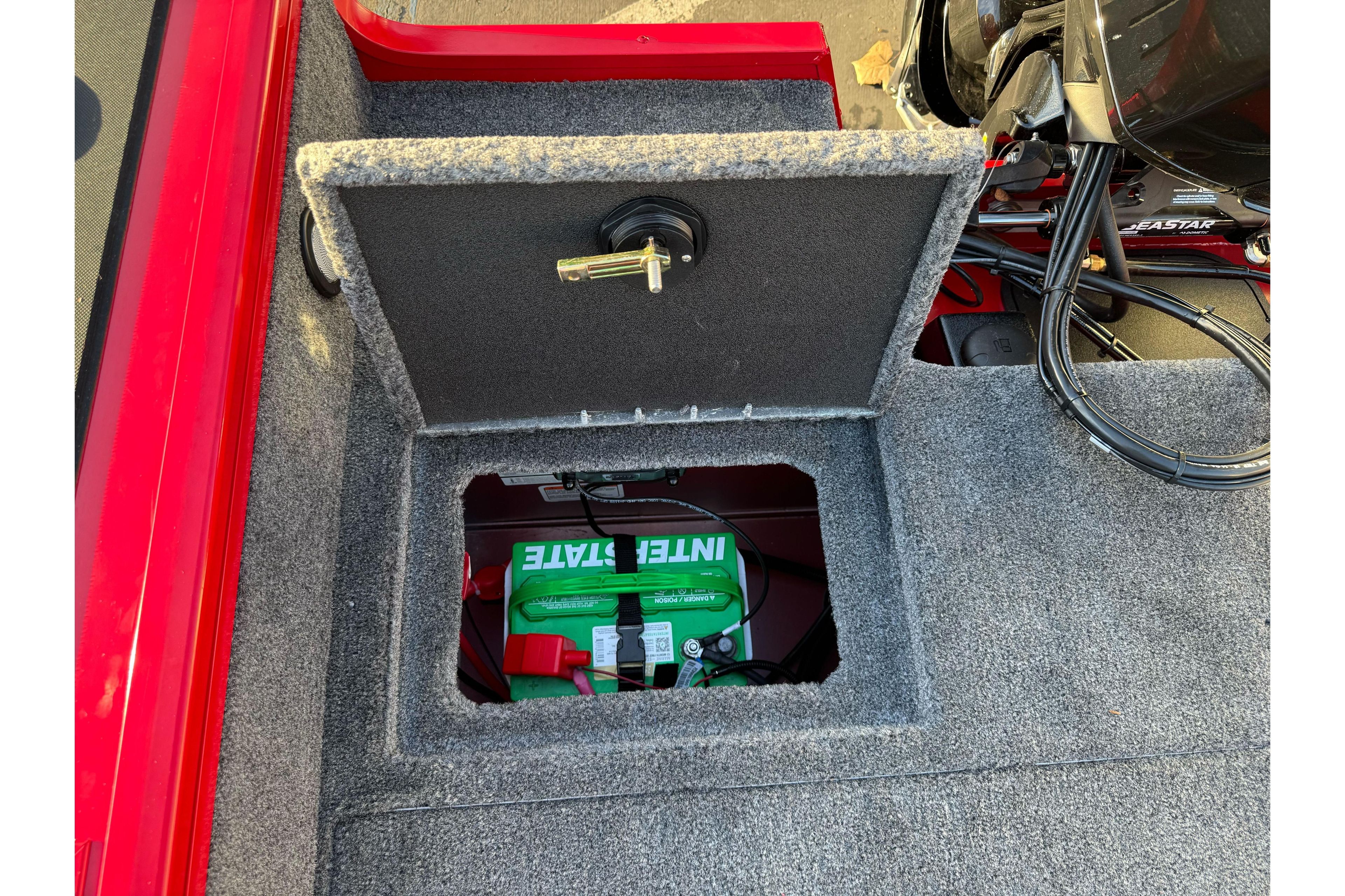 2026 Tracker Targa V-18 WT boat battery compartment with Interstate battery visible.