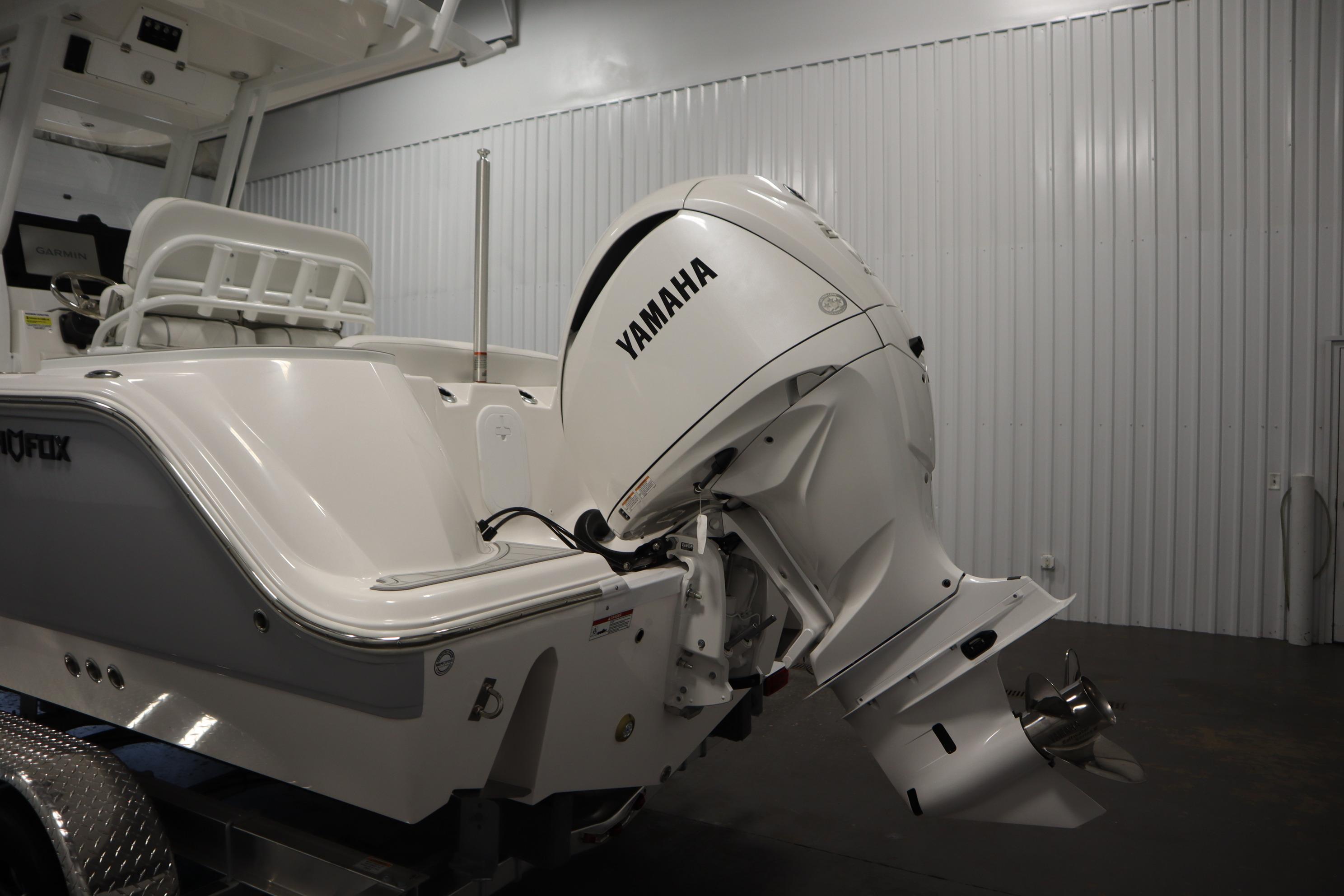 2026 Sea Fox 228 Commander boat with Yamaha outboard motor in a showroom.