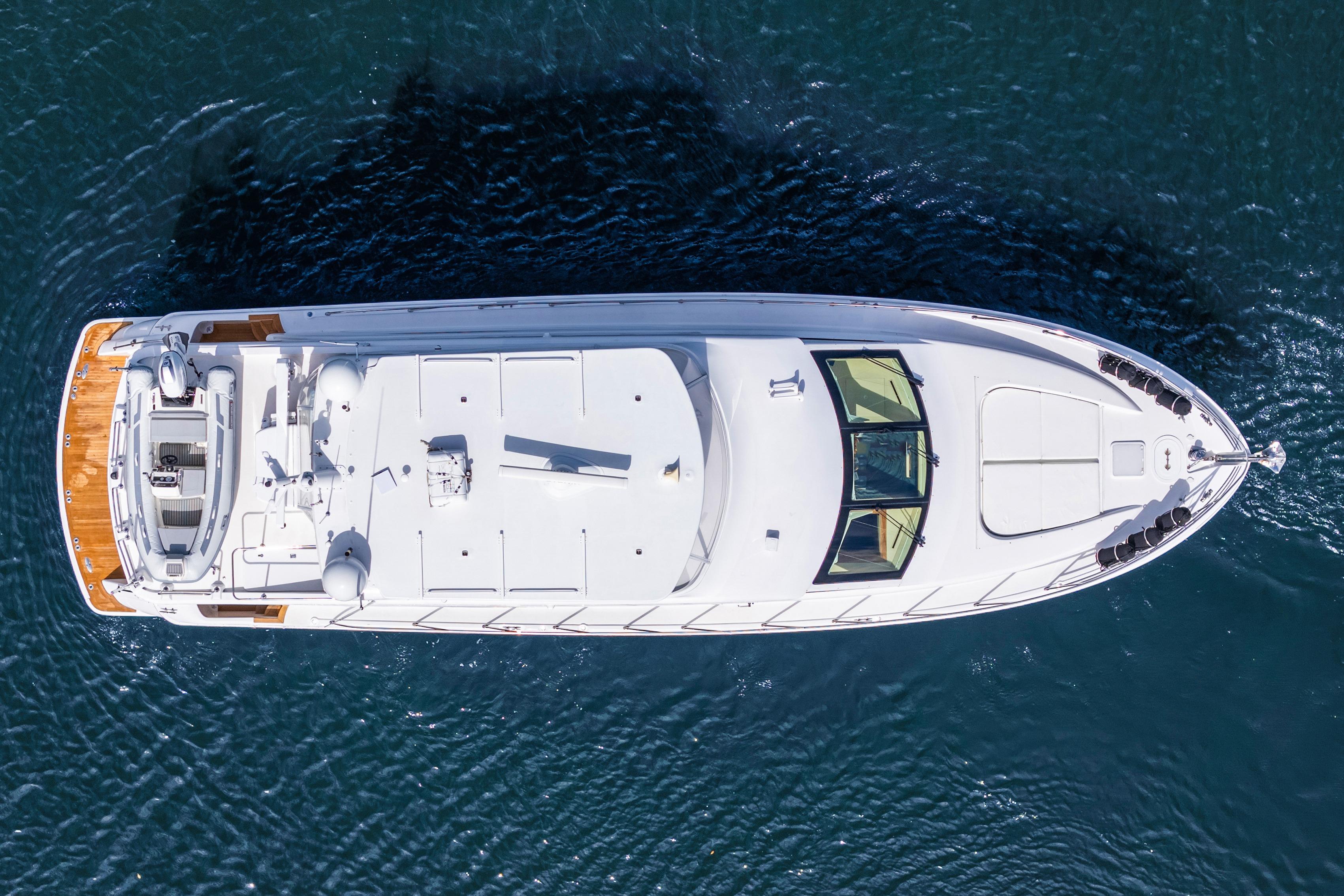 Aerial view of 2008 Hatteras 64 Motor Yacht on calm water.