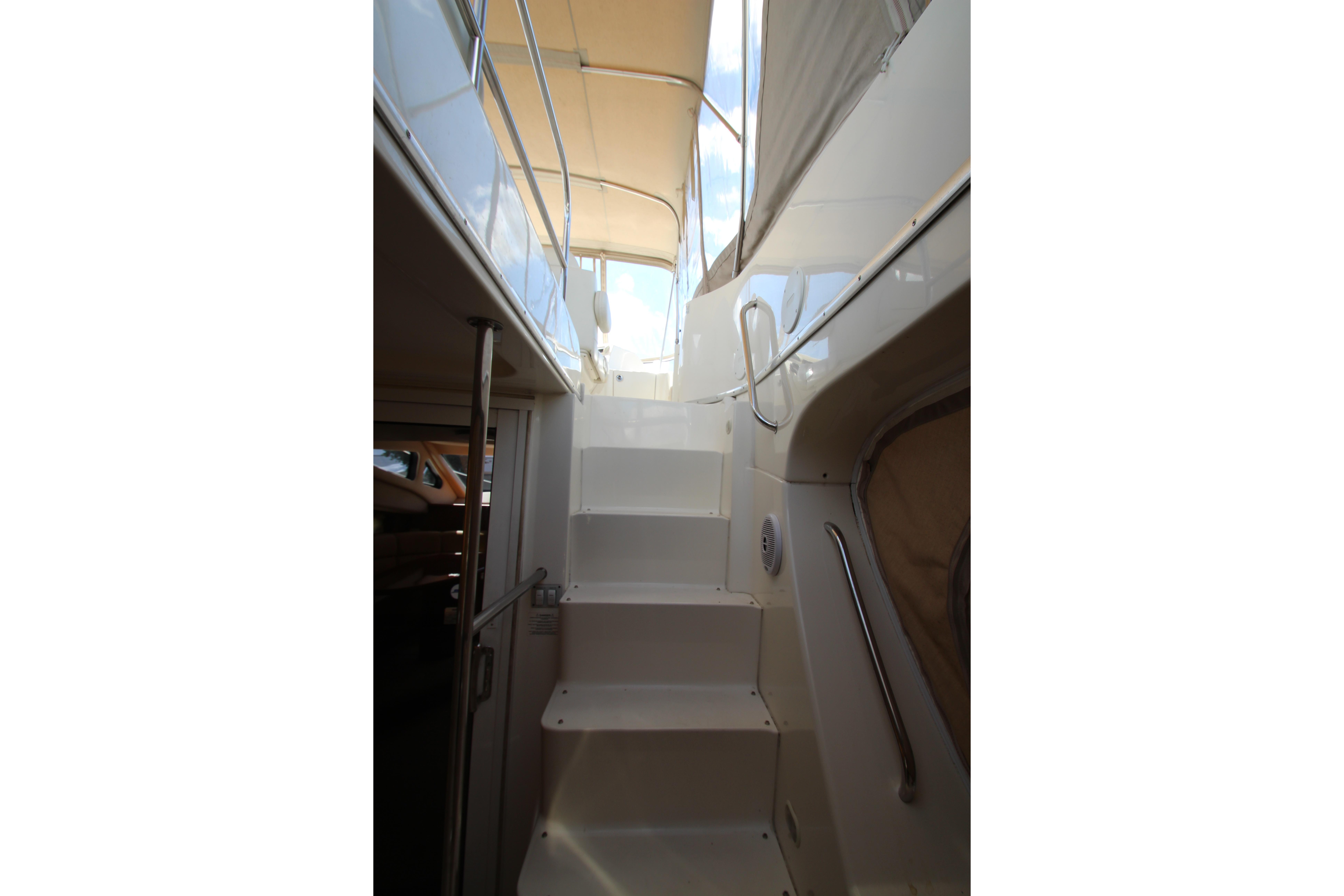 Staircase on 2006 Silverton 38 Sport Bridge yacht, leading to upper deck.