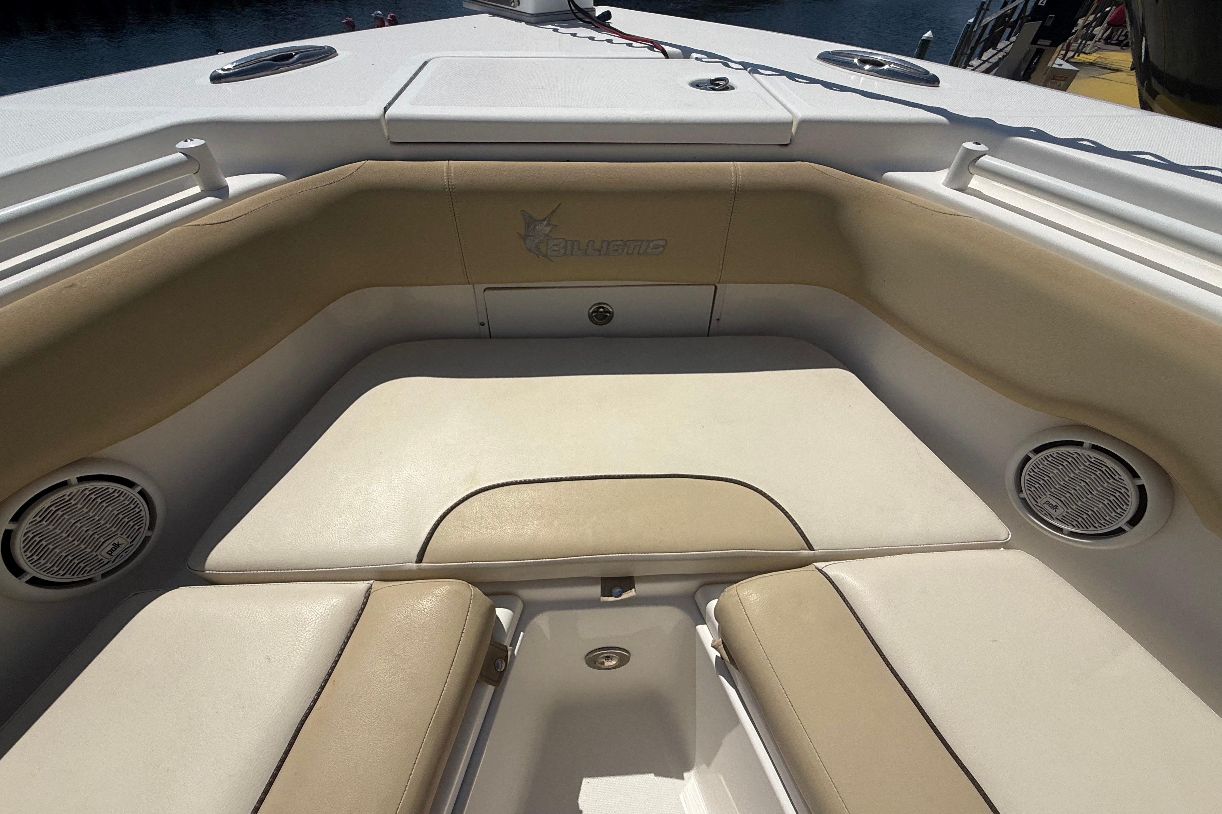 2019 Key West Billistic 281 Center Console boat interior with beige seating and speakers.