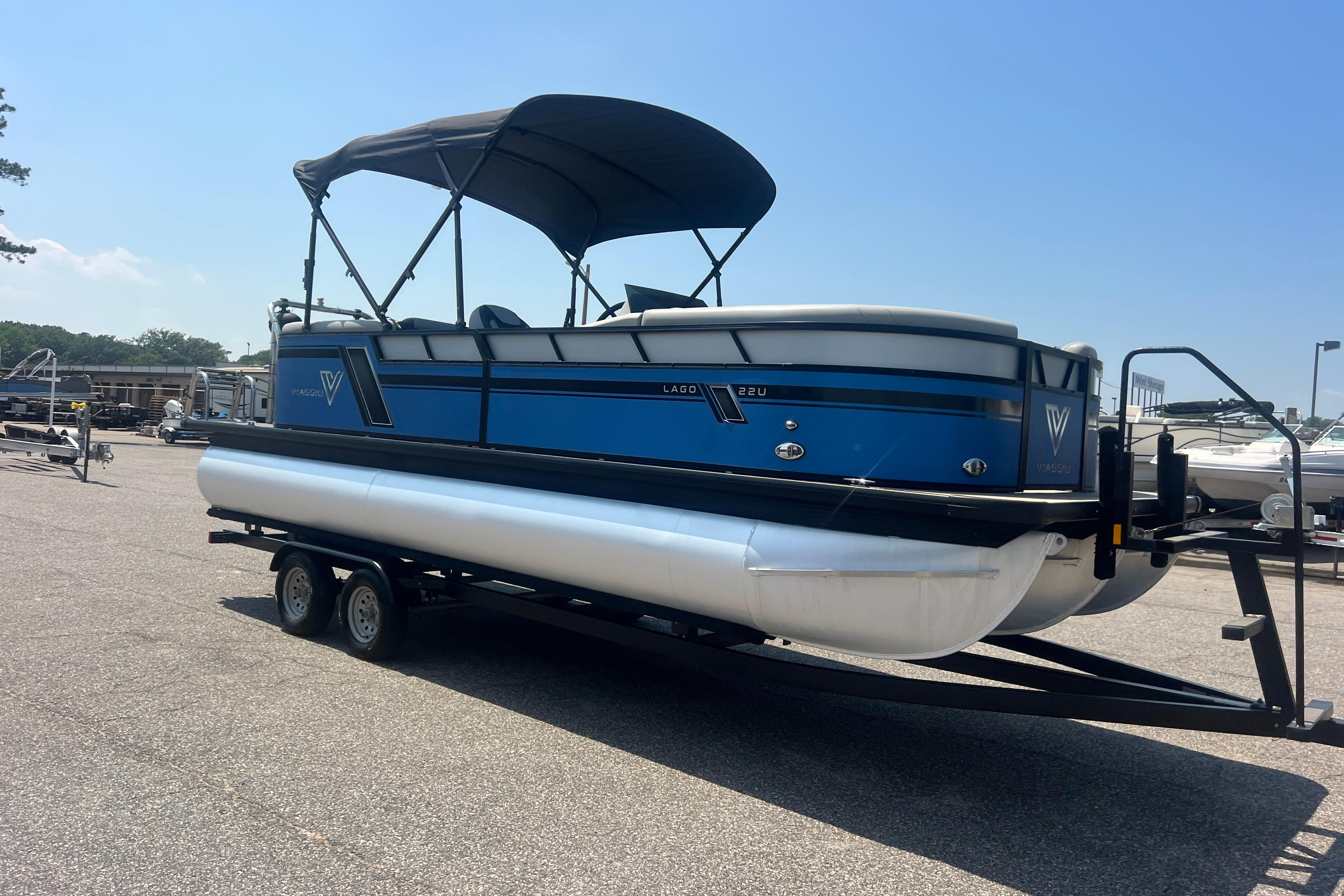 2022 Viaggio Lago V-U 22 pontoon boat on trailer, blue and white design.