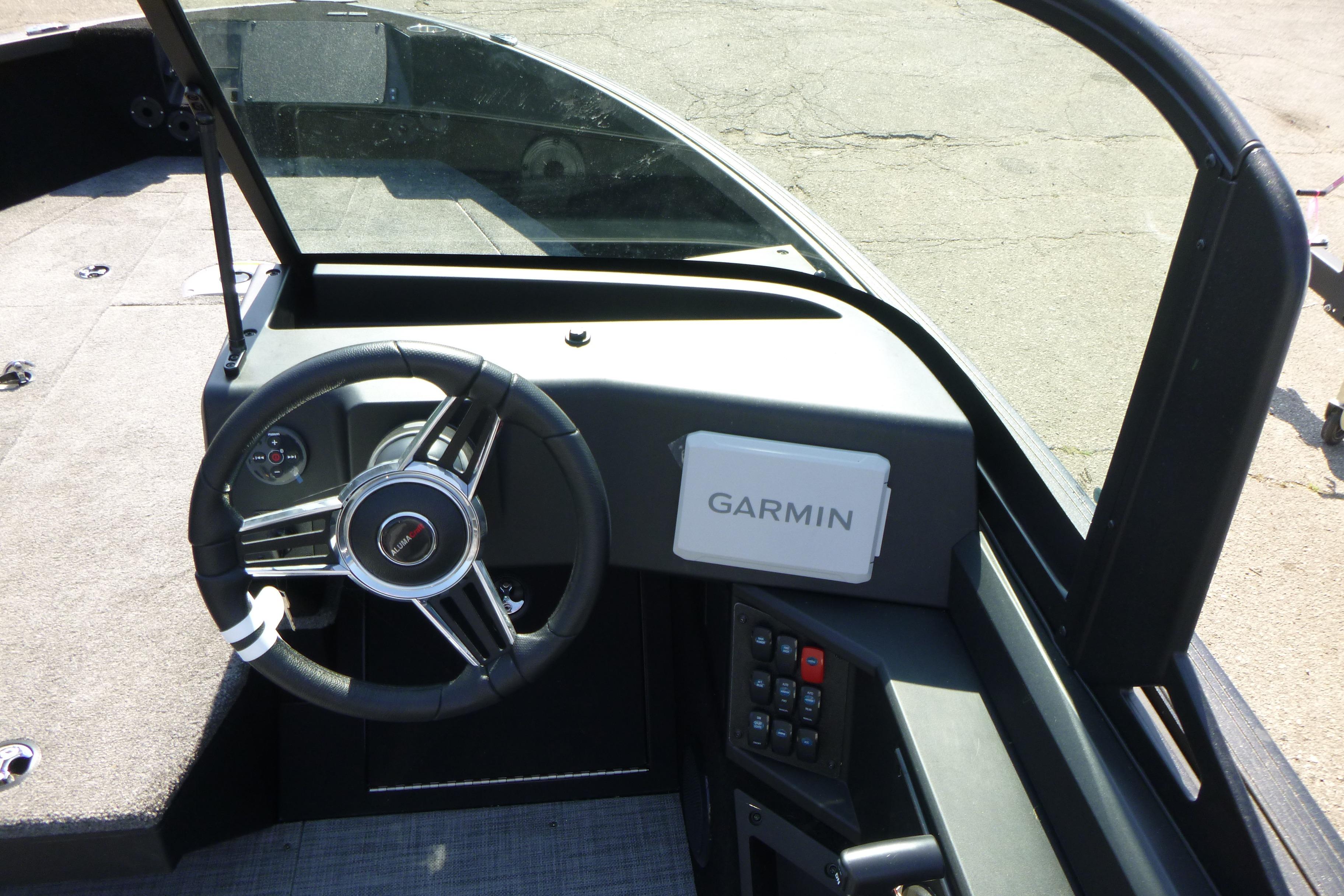 2024 Alumacraft Competitor 185X Sport dashboard with Garmin navigation system and steering wheel.