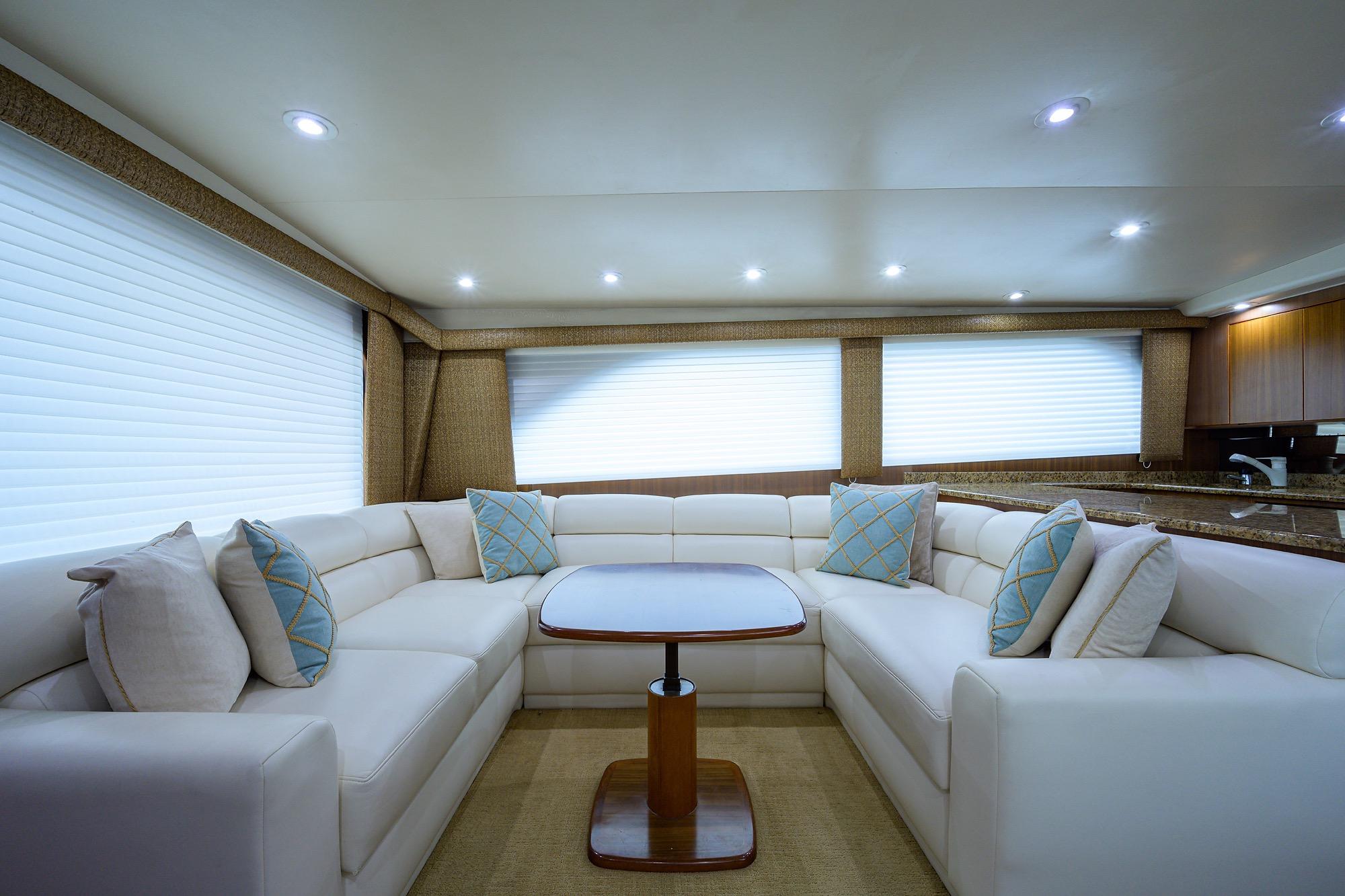 Luxurious interior of 2005 Viking 61 yacht with plush seating and elegant decor.