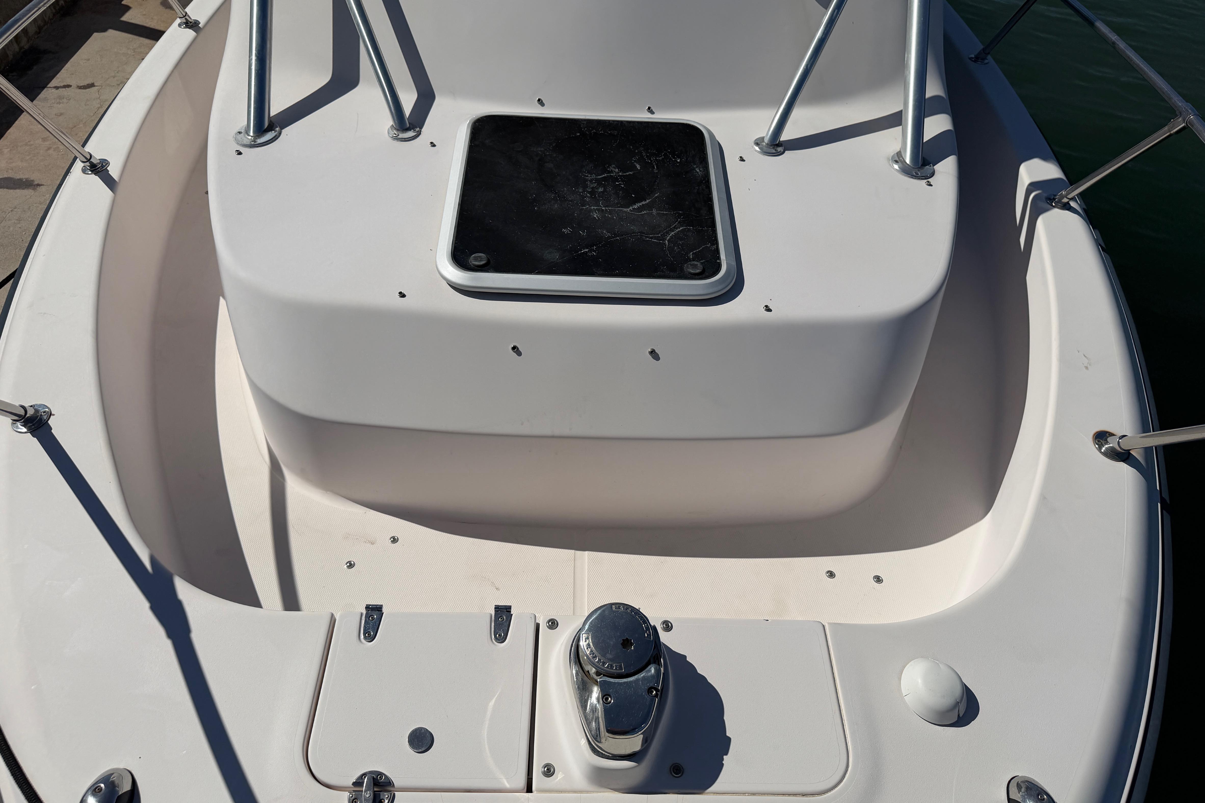 2006 Grady-White Sailfish 282 boat deck with storage hatch and railing.