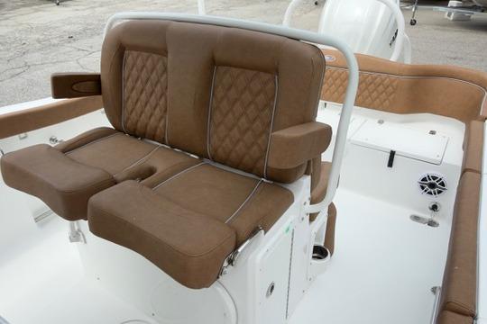 Luxurious seating on 2026 Sea Hunt Ultra 255 SE boat, featuring brown leather upholstery.