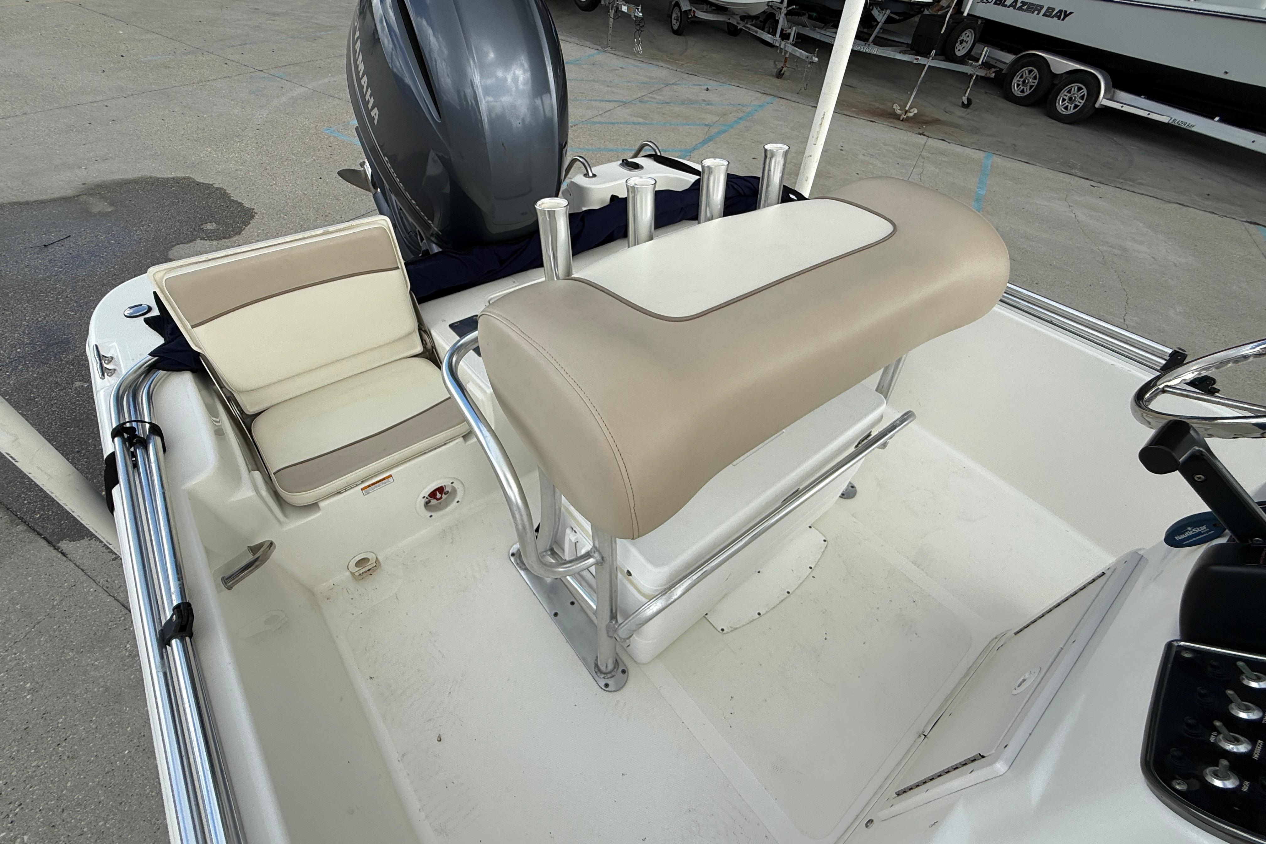 2017 NauticStar 1910 NauticBay boat interior with seating and steering console.