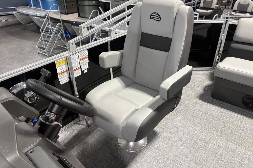 Captain's chair on 2026 Sun Tracker PARTY BARGE® 20 DLX pontoon boat, featuring sleek design.