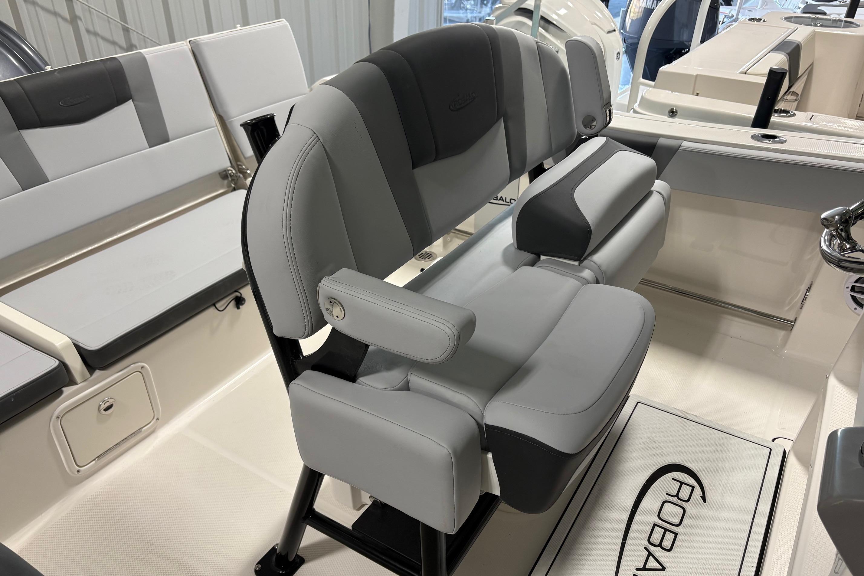 2025 Robalo R232 Explorer boat interior with gray seating and helm station.