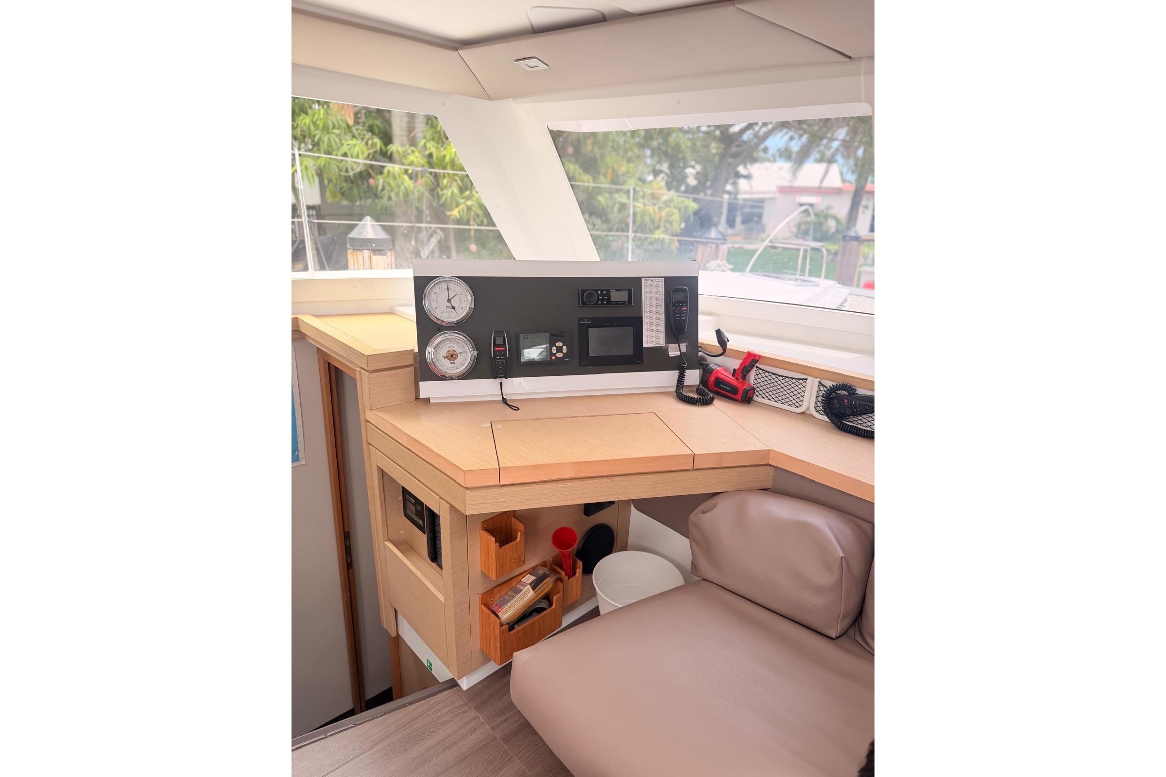 Interior helm station of 2018 Fountaine Pajot Lucia 40 catamaran, featuring navigation equipment.