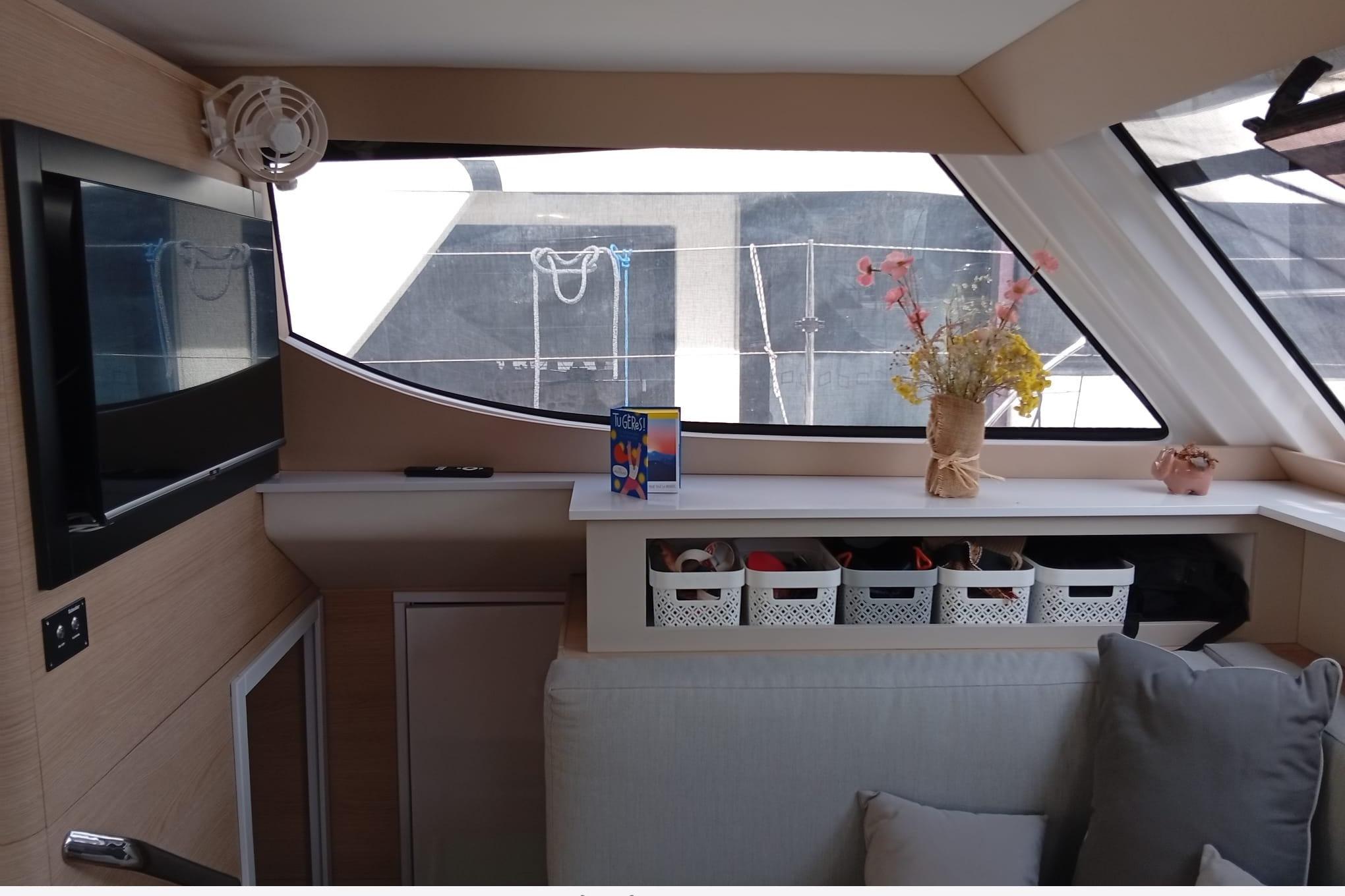 Interior of 2024 Aventura 37 yacht with modern decor and storage baskets.
