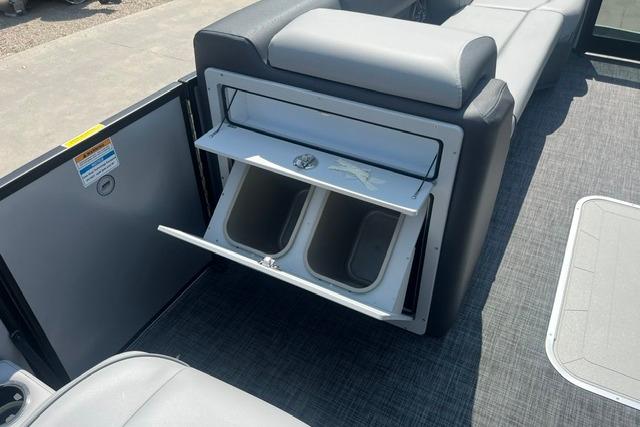 Interior of 2026 Godfrey Sweetwater 2286 SBC boat with storage compartments open.
