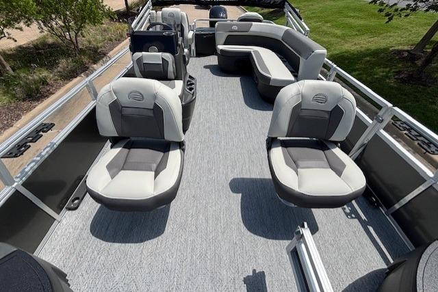 2026 Sun Tracker Bass Buggy 18 DLX pontoon boat interior with seating and helm.