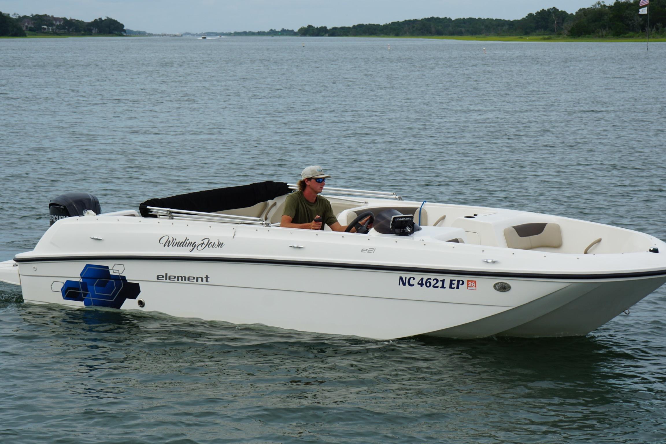2017 Bayliner Element F21 boat cruising on a calm lake.