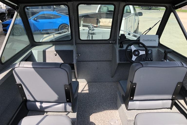 Interior of 2023 Alumaweld Talon 18 boat with Garmin navigation system.