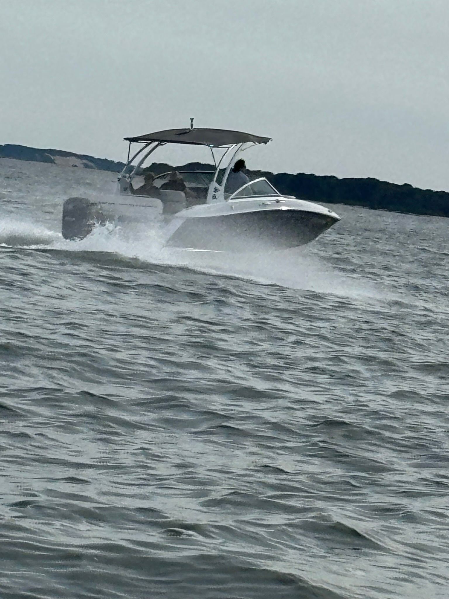 Cobalt SC23 boat from 2020 speeding on the water.