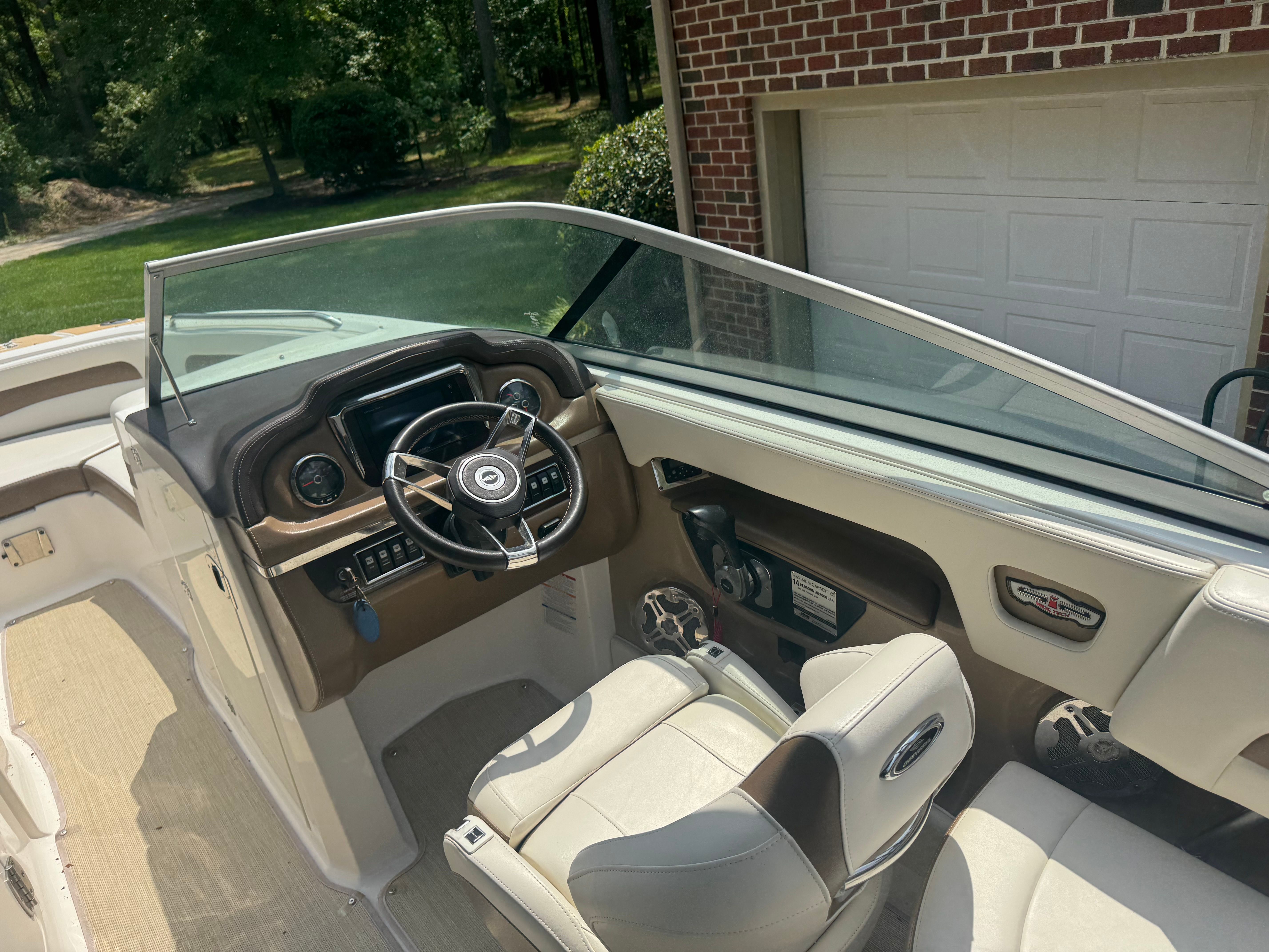 Interior of a 2016 Chaparral 246 SSi boat with steering console.