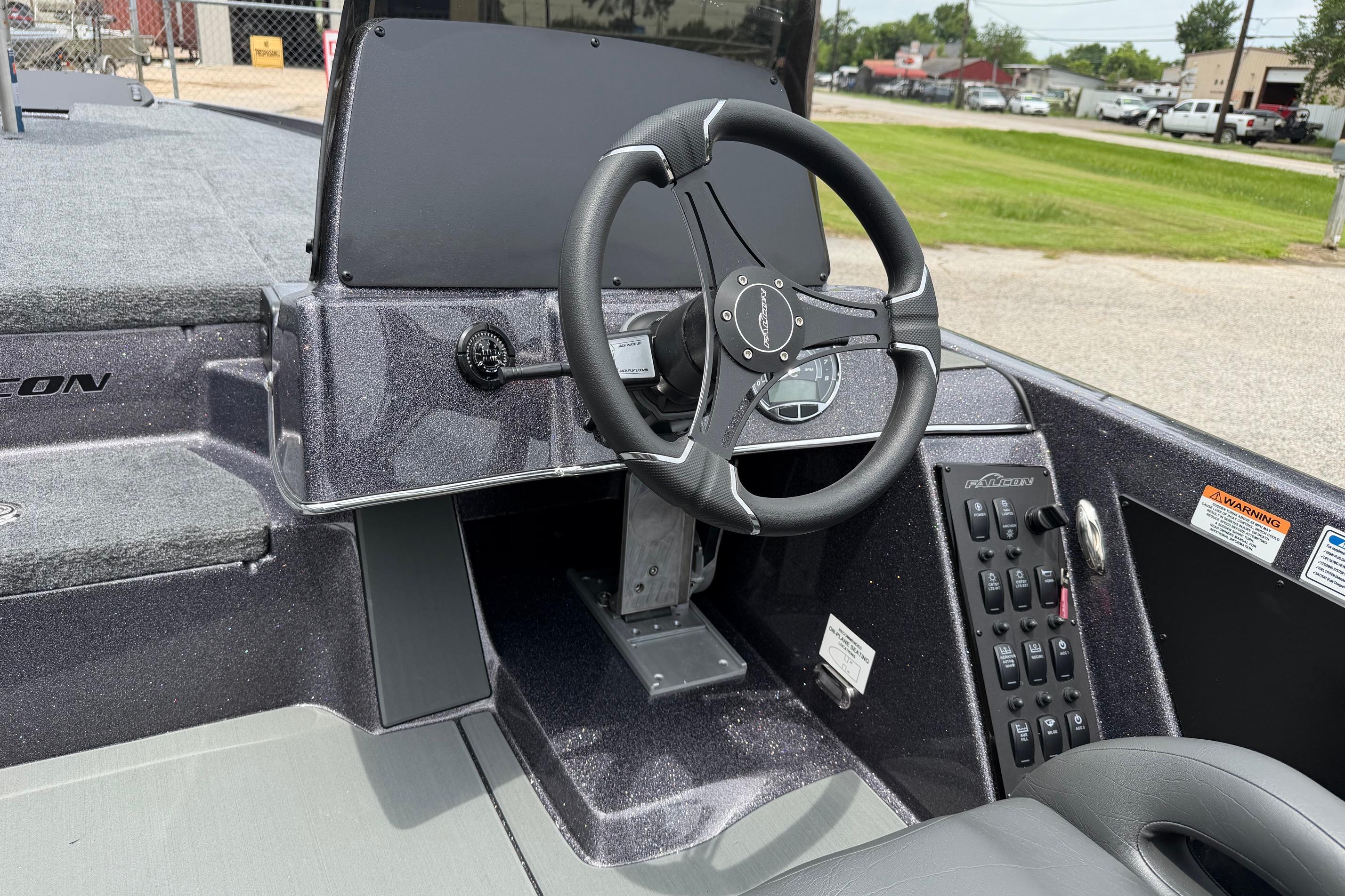 2027 Falcon Boats F215 steering console with modern controls and sleek design.