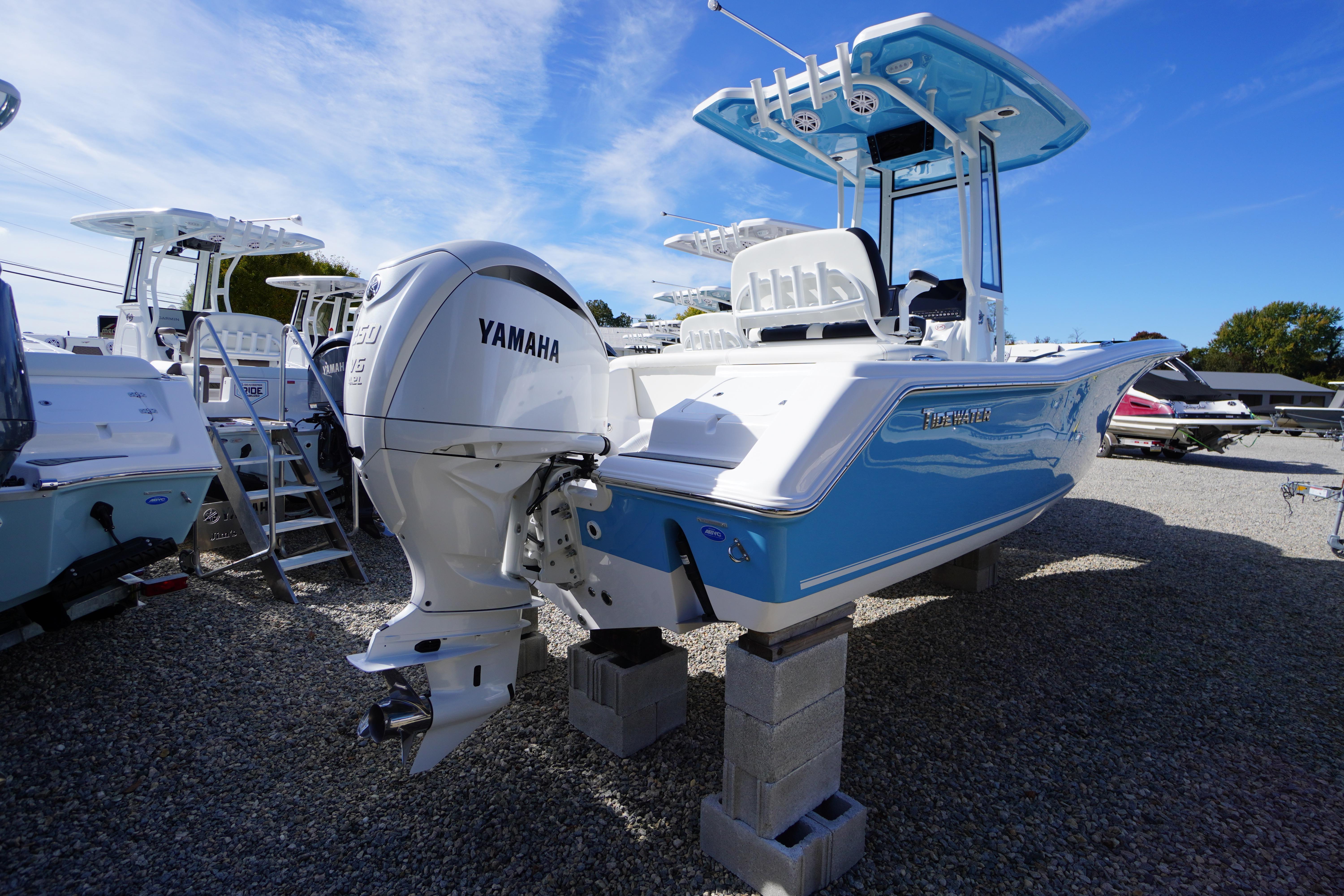 2026 Tidewater 220 LXF boat with Yamaha engine on display outdoors.
