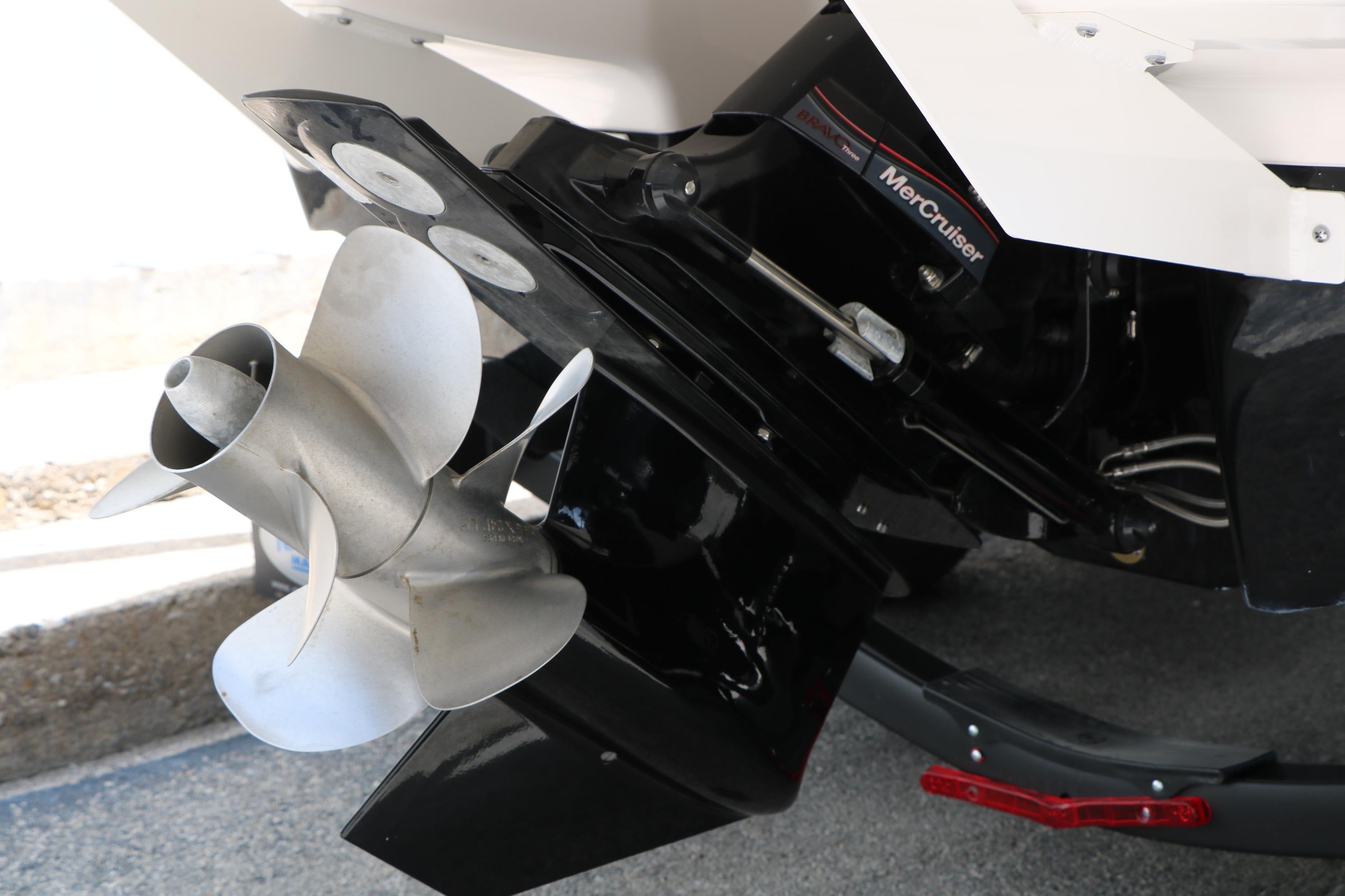 2025 Chaparral 23 SSi boat with MerCruiser engine and stainless steel propeller.