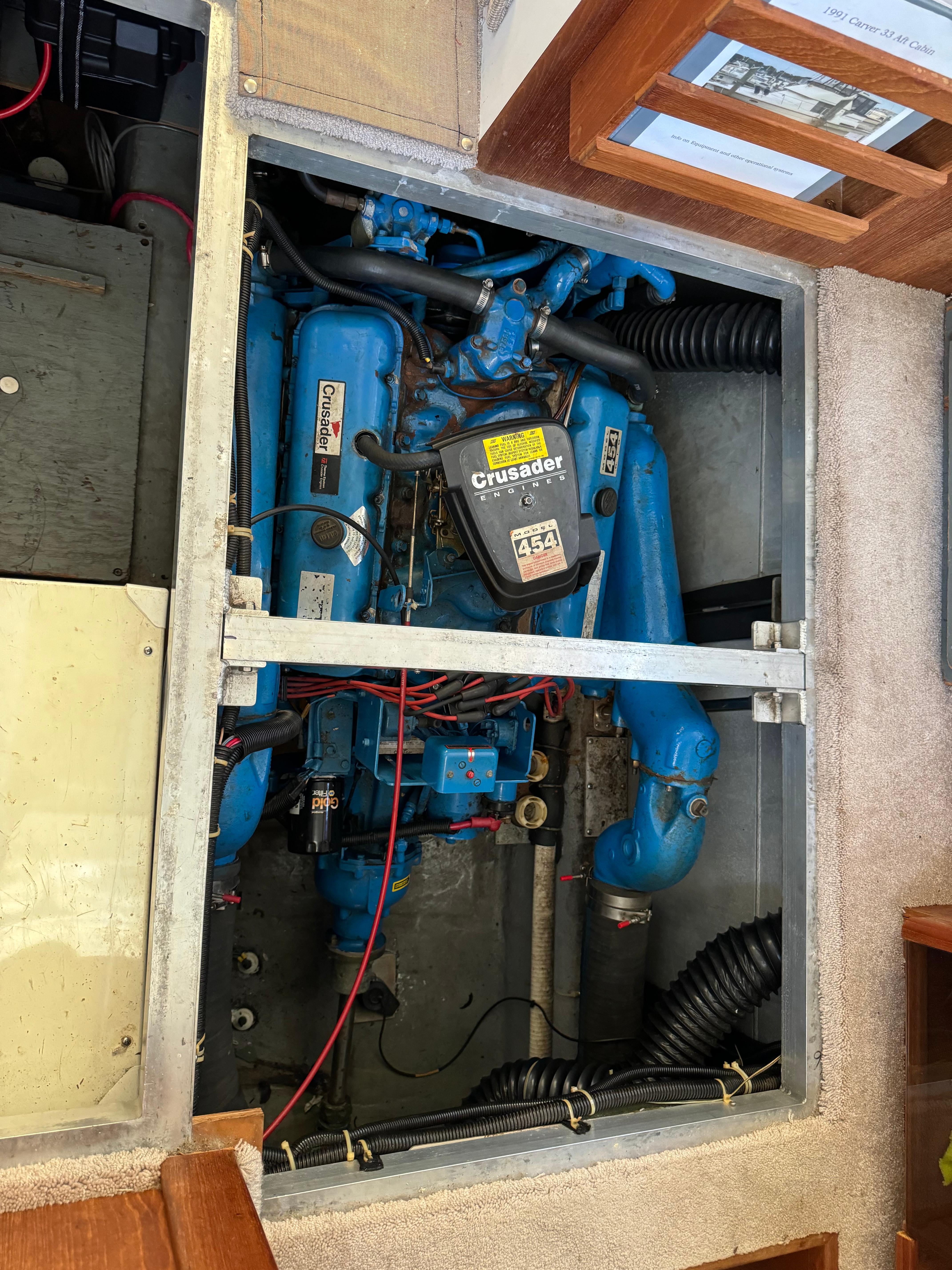 Engine compartment of a 1991 Carver 33 Aft Cabin boat, featuring a Crusader engine.