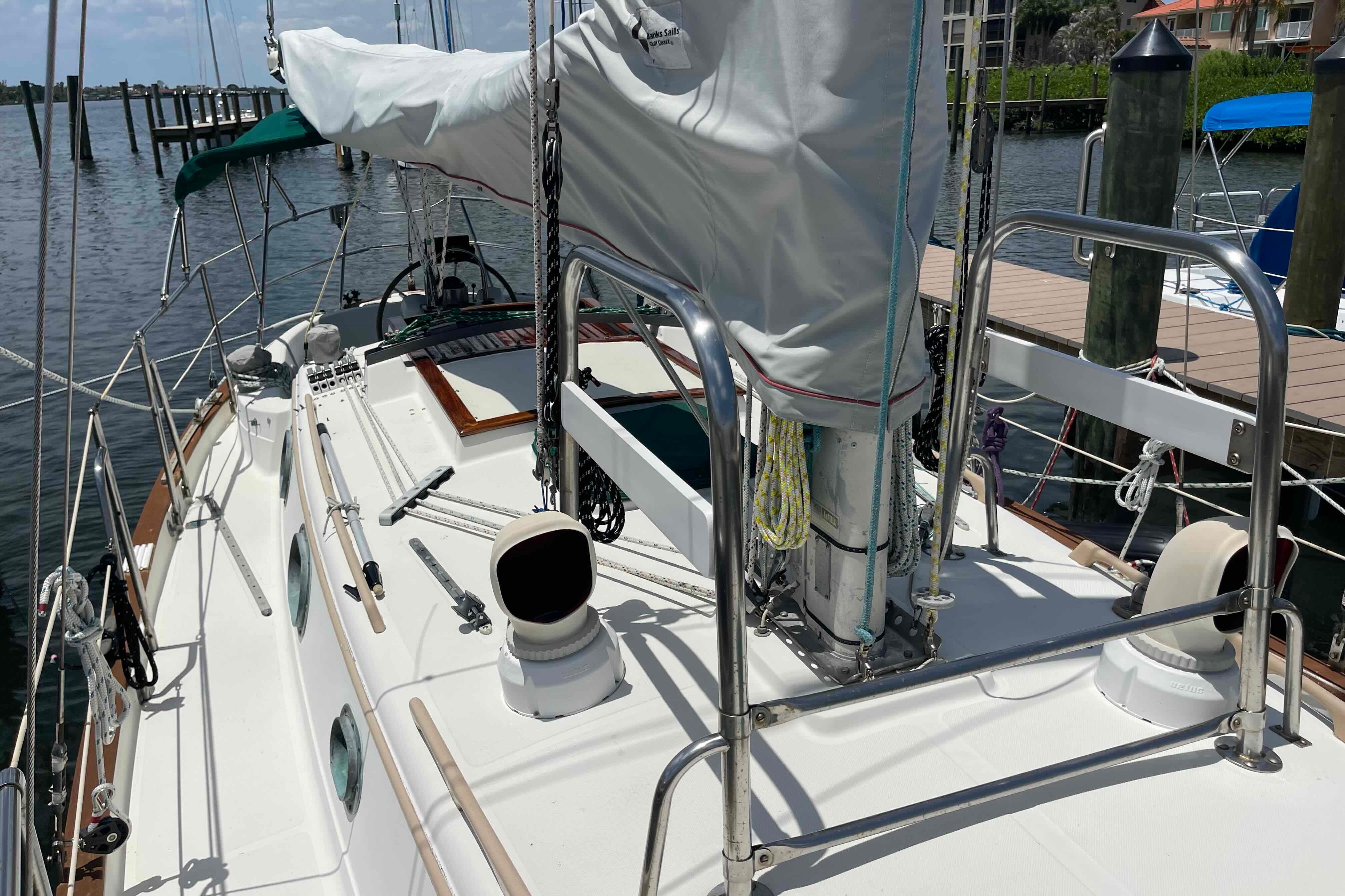 1987 Pacific Seacraft 34 sailboat docked, showcasing deck and rigging details.