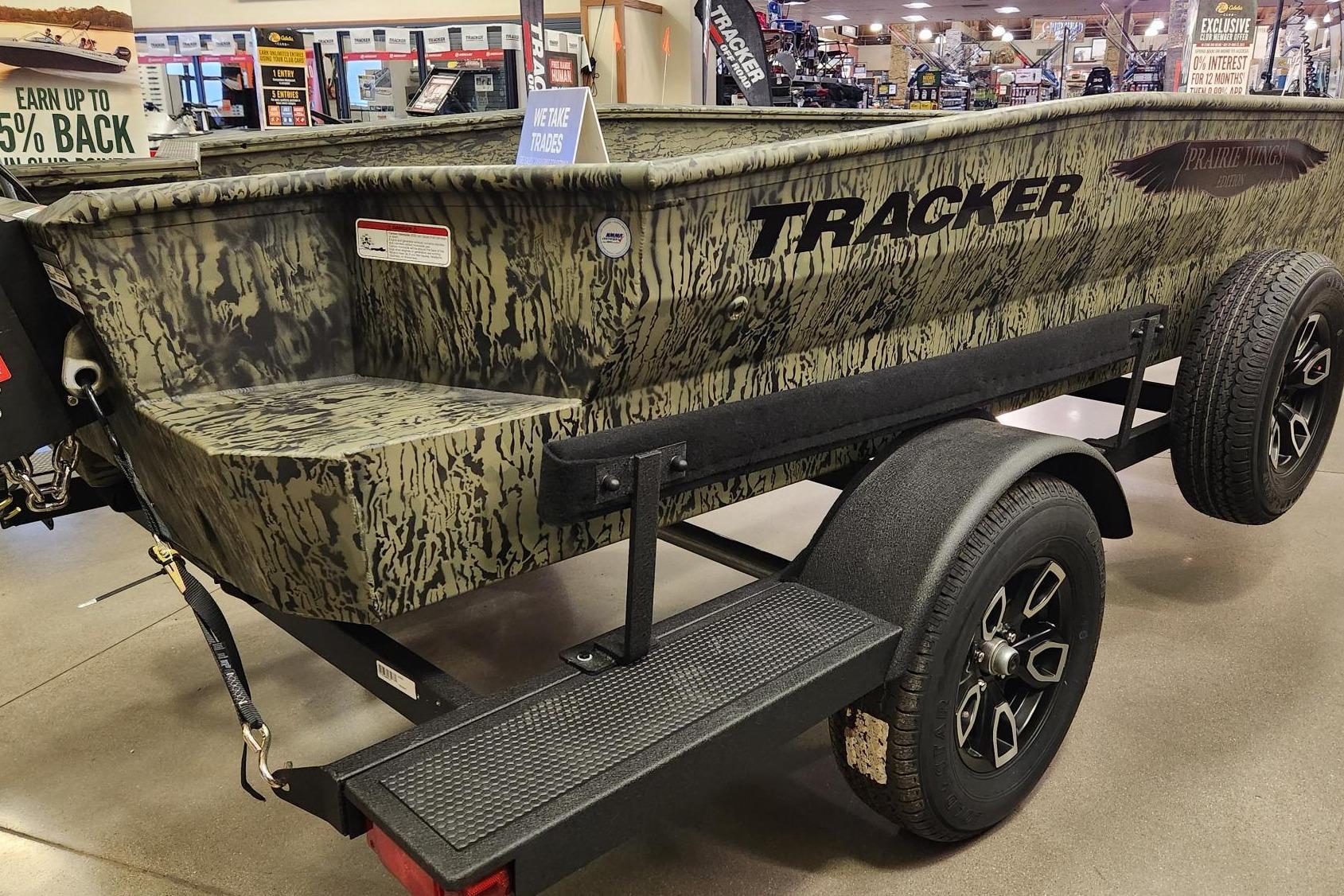 2025 Tracker Grizzly 1650 T Prairie Wings Edition boat on display in showroom.