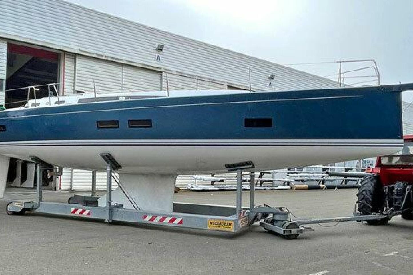 2026 J Boats J/45 sailboat on trailer outside a warehouse.