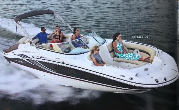 2012 Godfrey Hurricane boat on water with passengers.