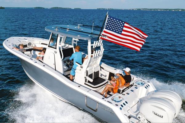 Manufacturer Provided Image: Tidewater 282 CC Adventure 2026 cruising with American flag on open sea.