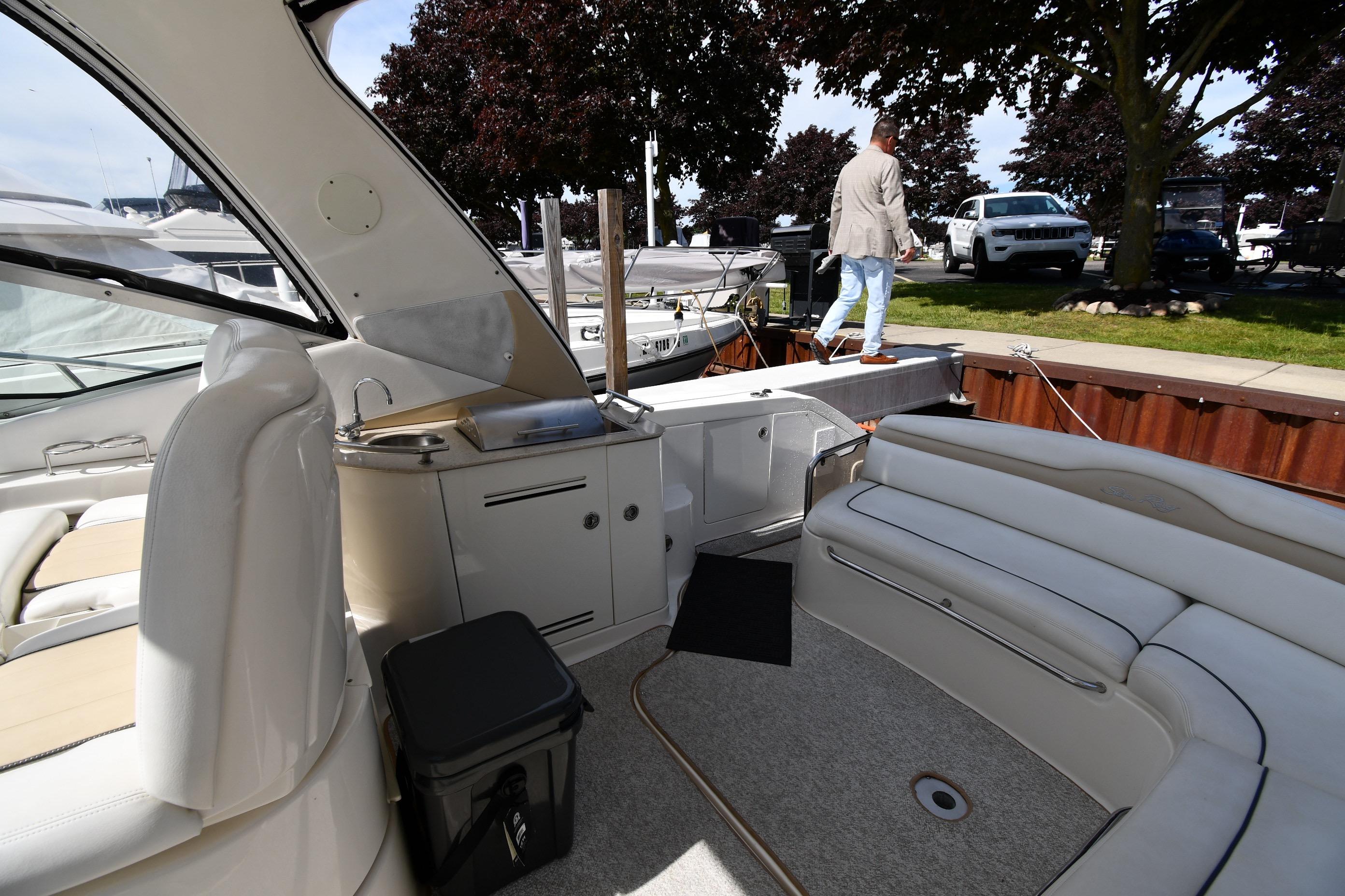 2008 Sea Ray Sundancer 350 interior with seating and dock view.
