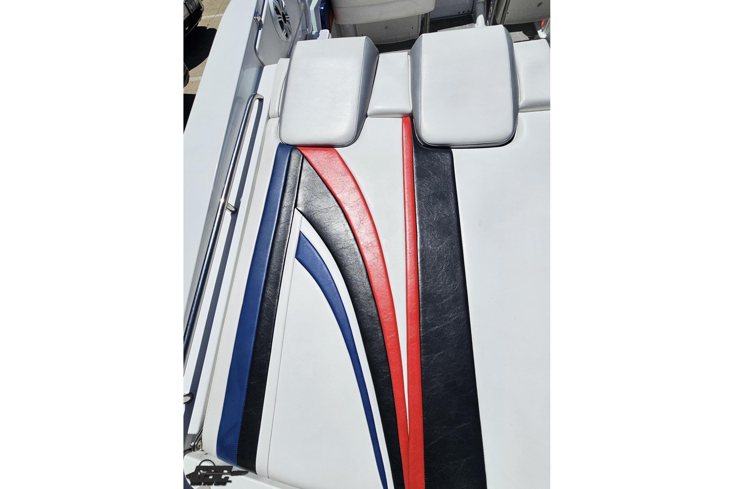 2005 Formula 271 FASTech boat interior with red, blue, and black striped upholstery.