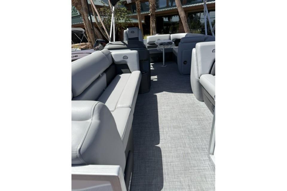2026 Sun Tracker Party Barge 20 DLX interior with gray seating and flooring.