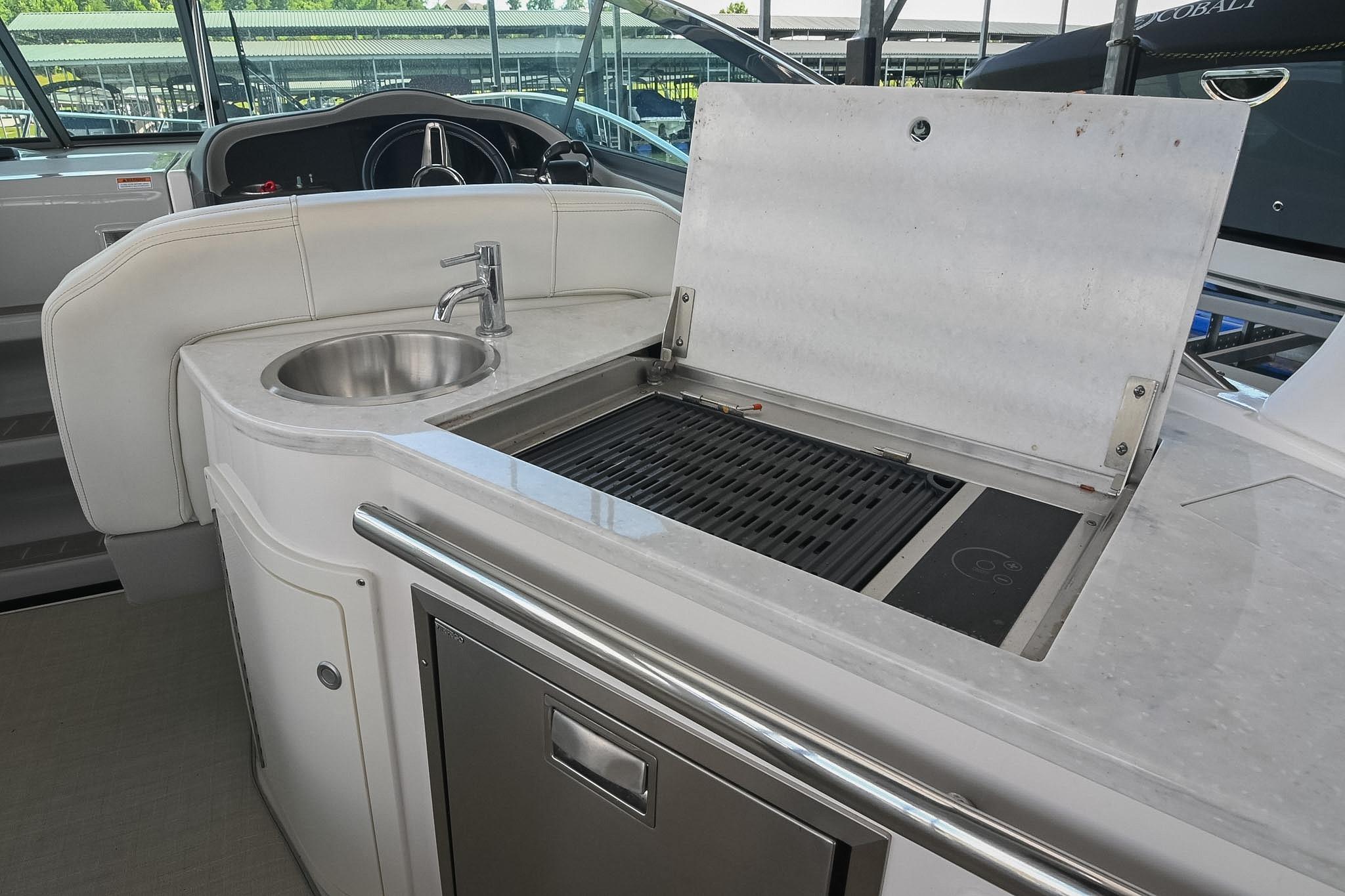 2021 Regal 33 Express yacht interior with sink and grill station.