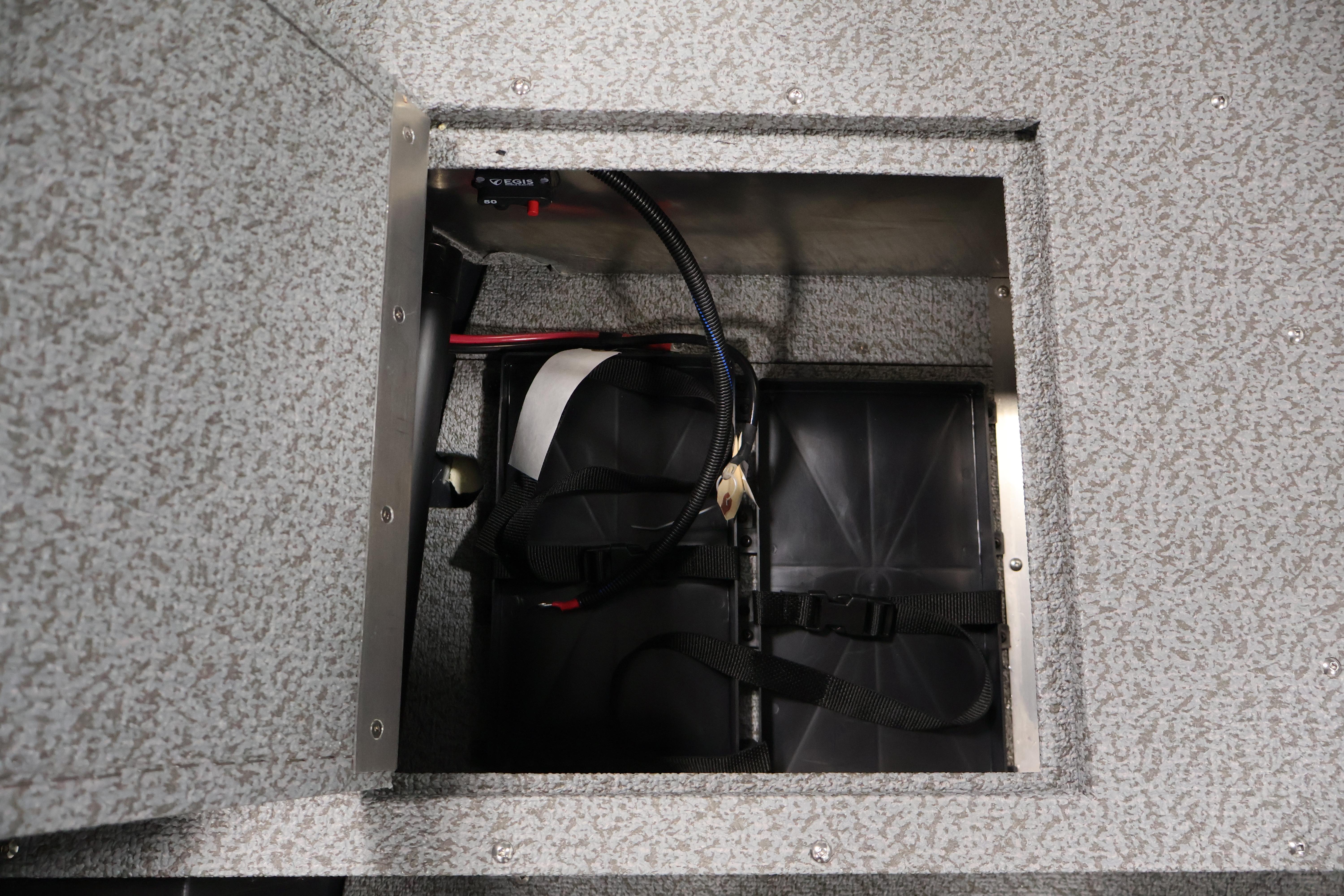 Battery compartment of 2026 Crestliner 1850 Kodiak SC boat, featuring secure wiring.