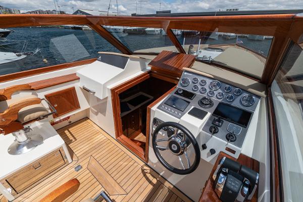 Cockpit of 2023 Vento V40 Retro Classic Open yacht with wooden accents and modern controls.
