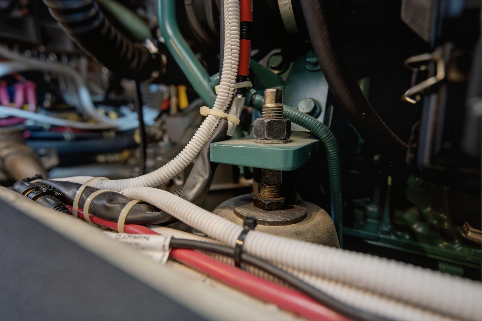 Engine compartment of a 2005 Carver 39 Motor Yacht with visible wiring and components.
