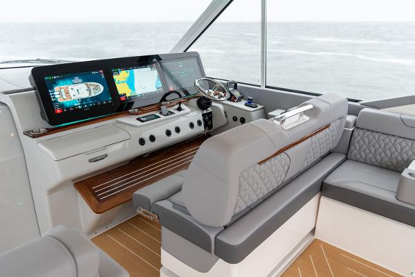 Manufacturer Provided Image: Luxurious 2026 Regal LX43 yacht interior with advanced navigation displays and plush seating.