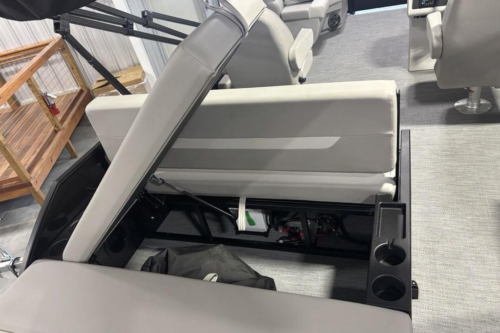 2026 Godfrey Xperience 2086 SFLX boat interior with open storage compartment and seating.