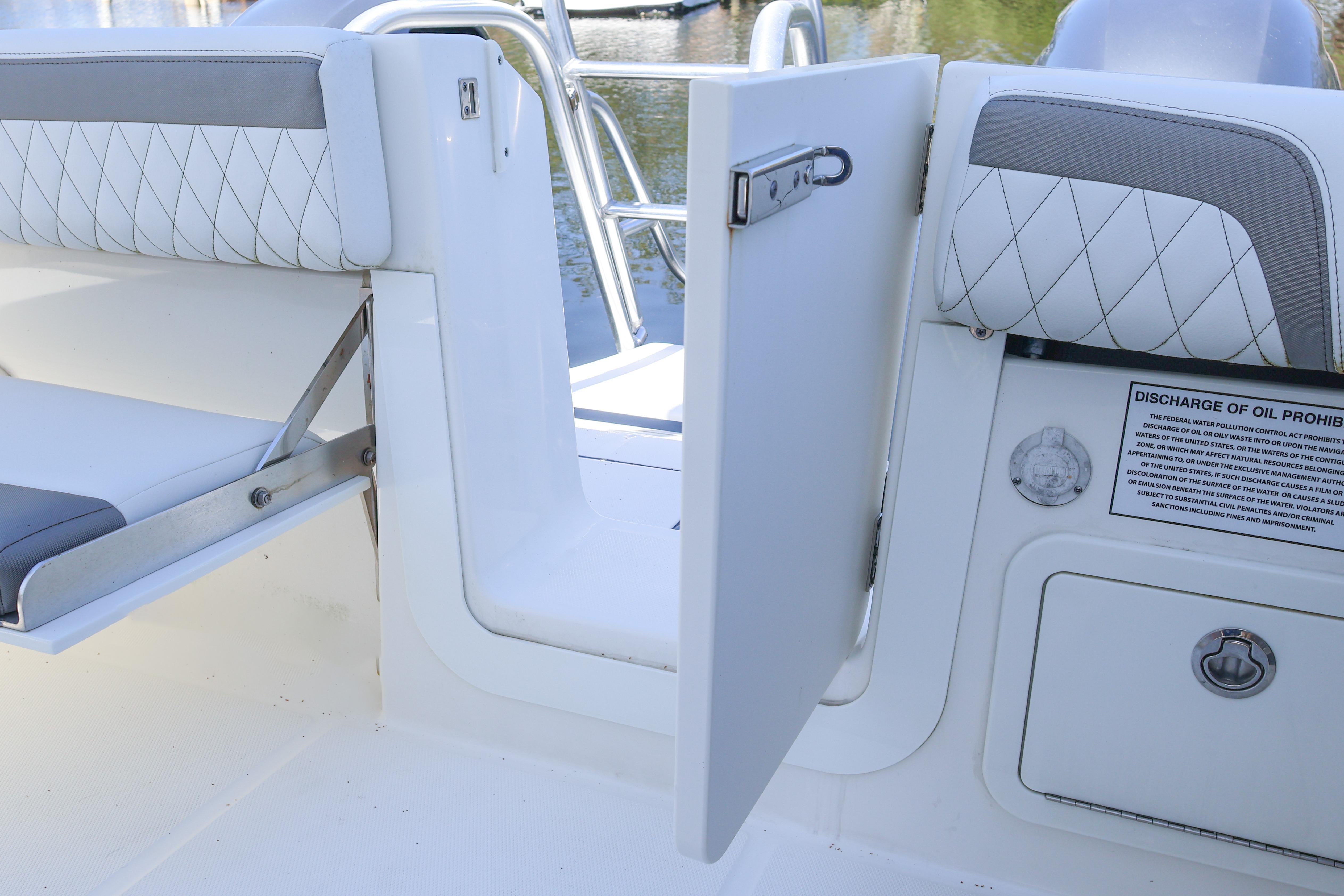 2022 World Cat 280 CC-X boat interior with open door and seating area.