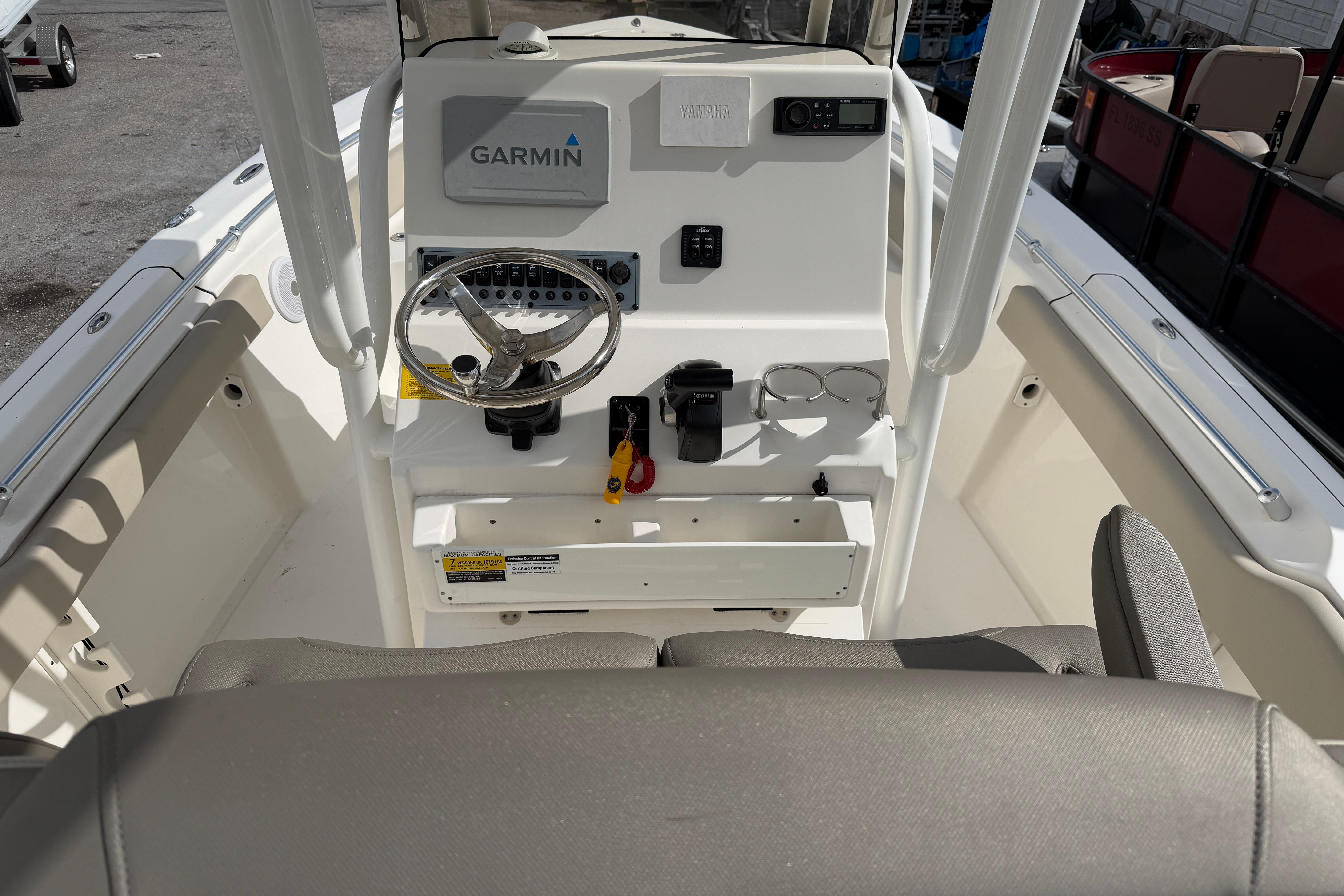 2022 Key West 219 FS boat console with Garmin navigation system and steering wheel.