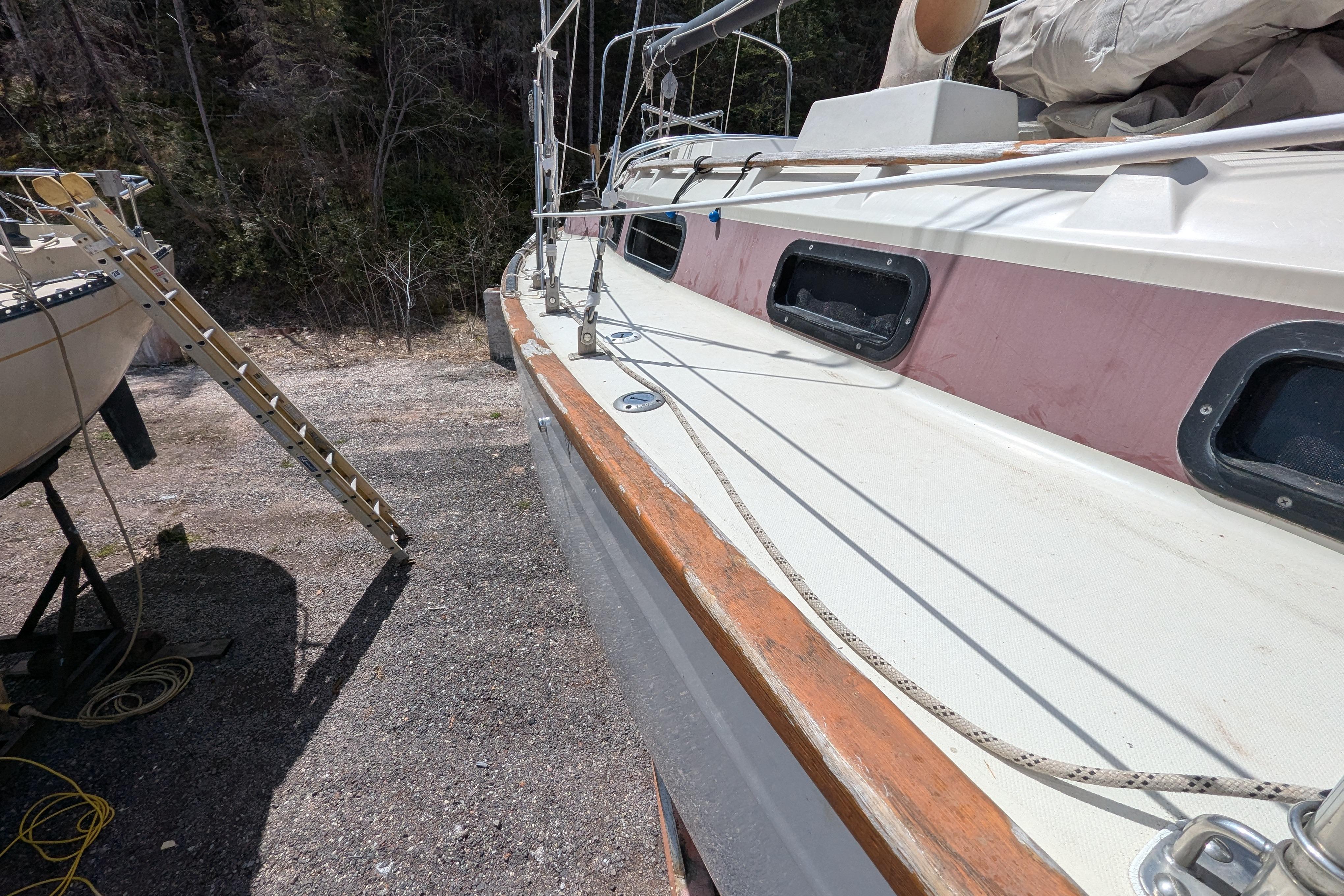 1982 Pearson 323 sailboat on land, showing deck and rigging details.