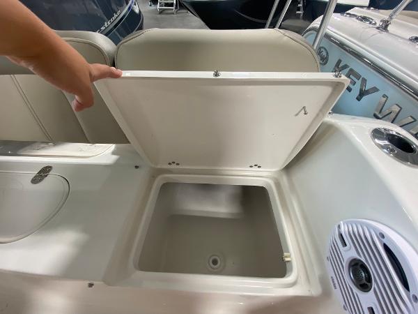 2024 Key West 189 FS boat storage compartment with open lid and speaker.