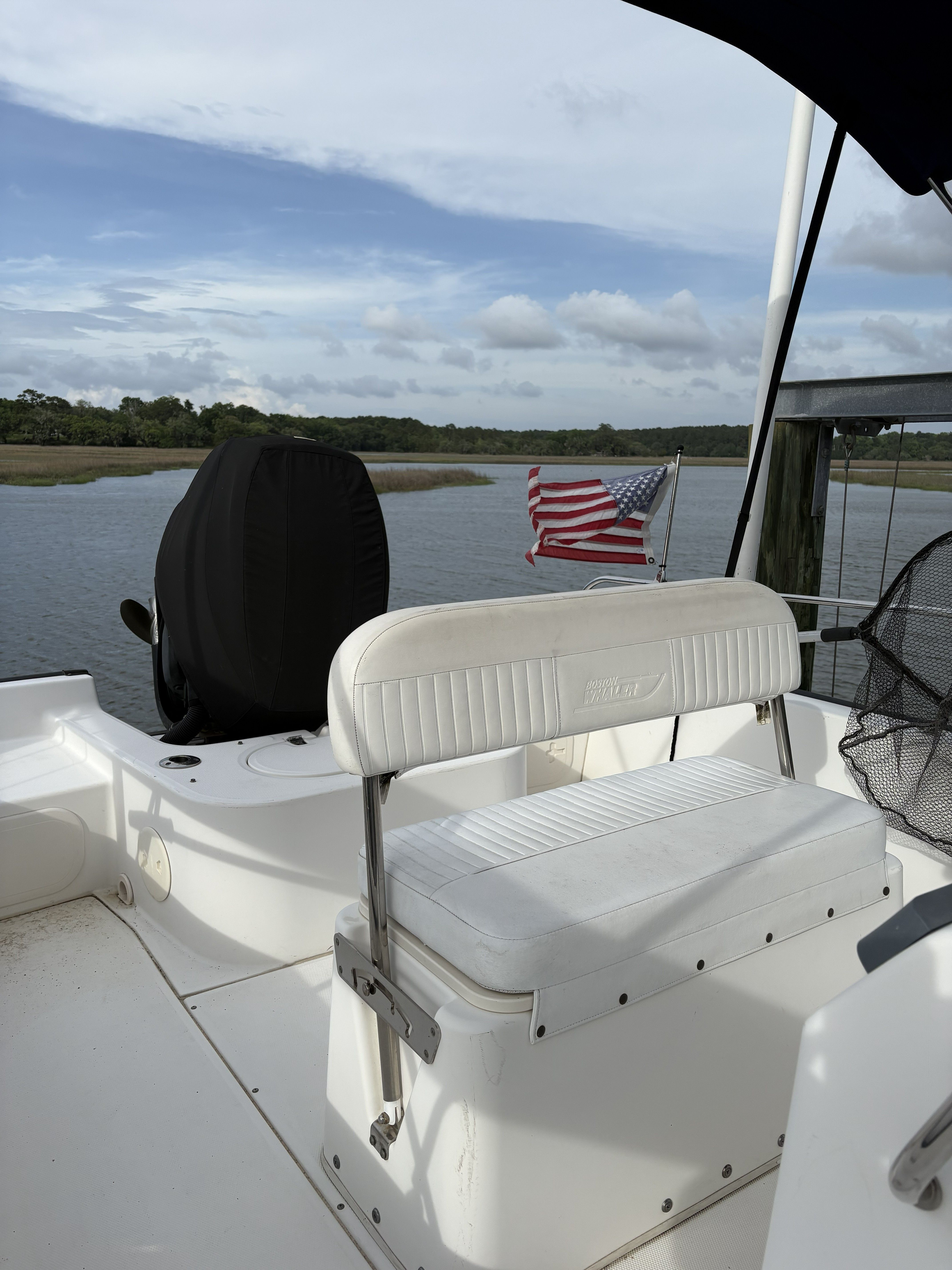 Boston Whaler 190 Montauk 2012 with American flag on calm waters.