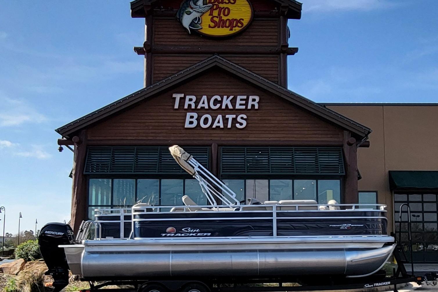 2025 Sun Tracker Fishin' Barge 22 XP3 displayed at Tracker Boats store.