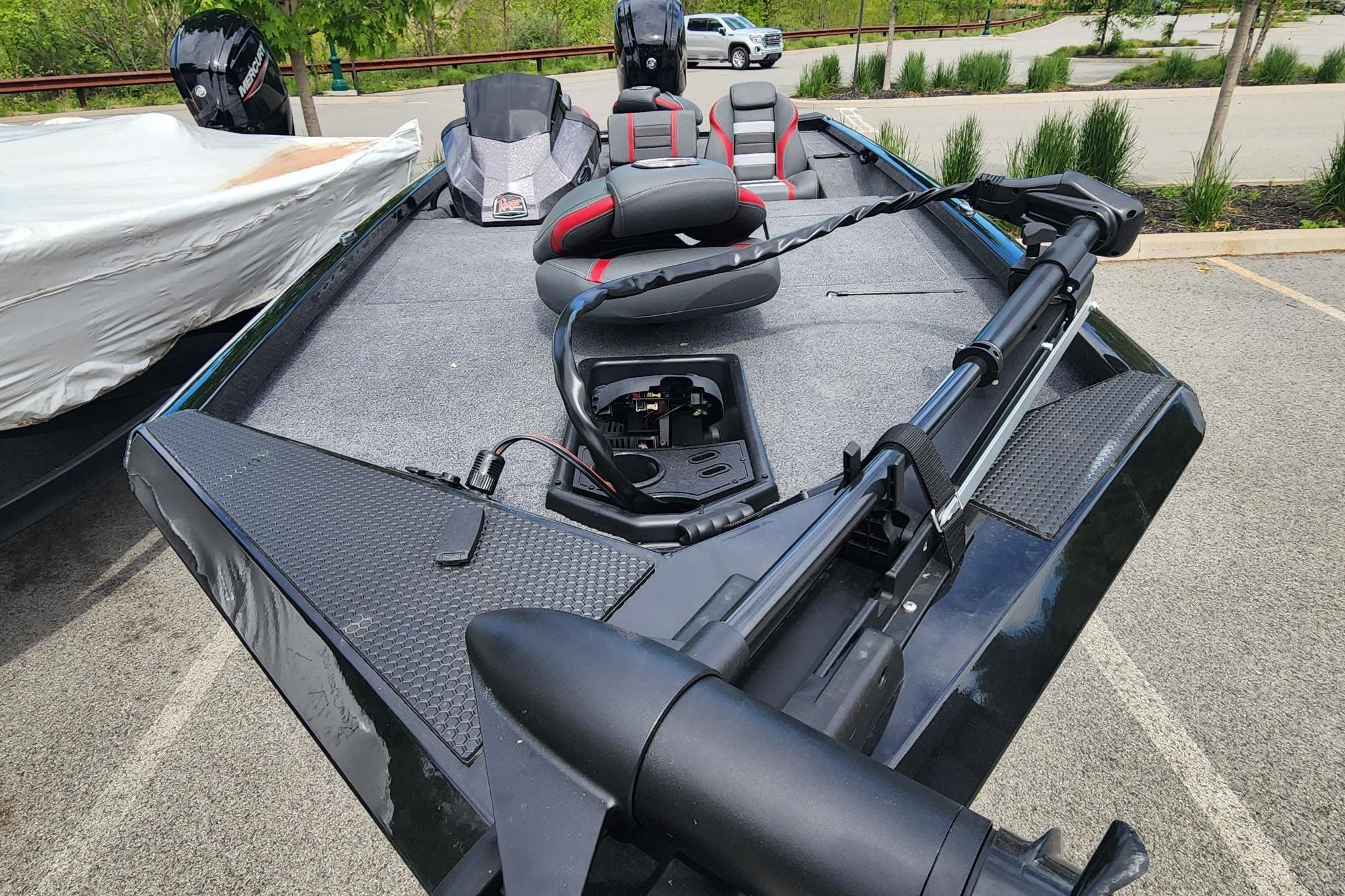 2026 Ranger RT188 fishing boat with trolling motor and seating, parked outdoors.