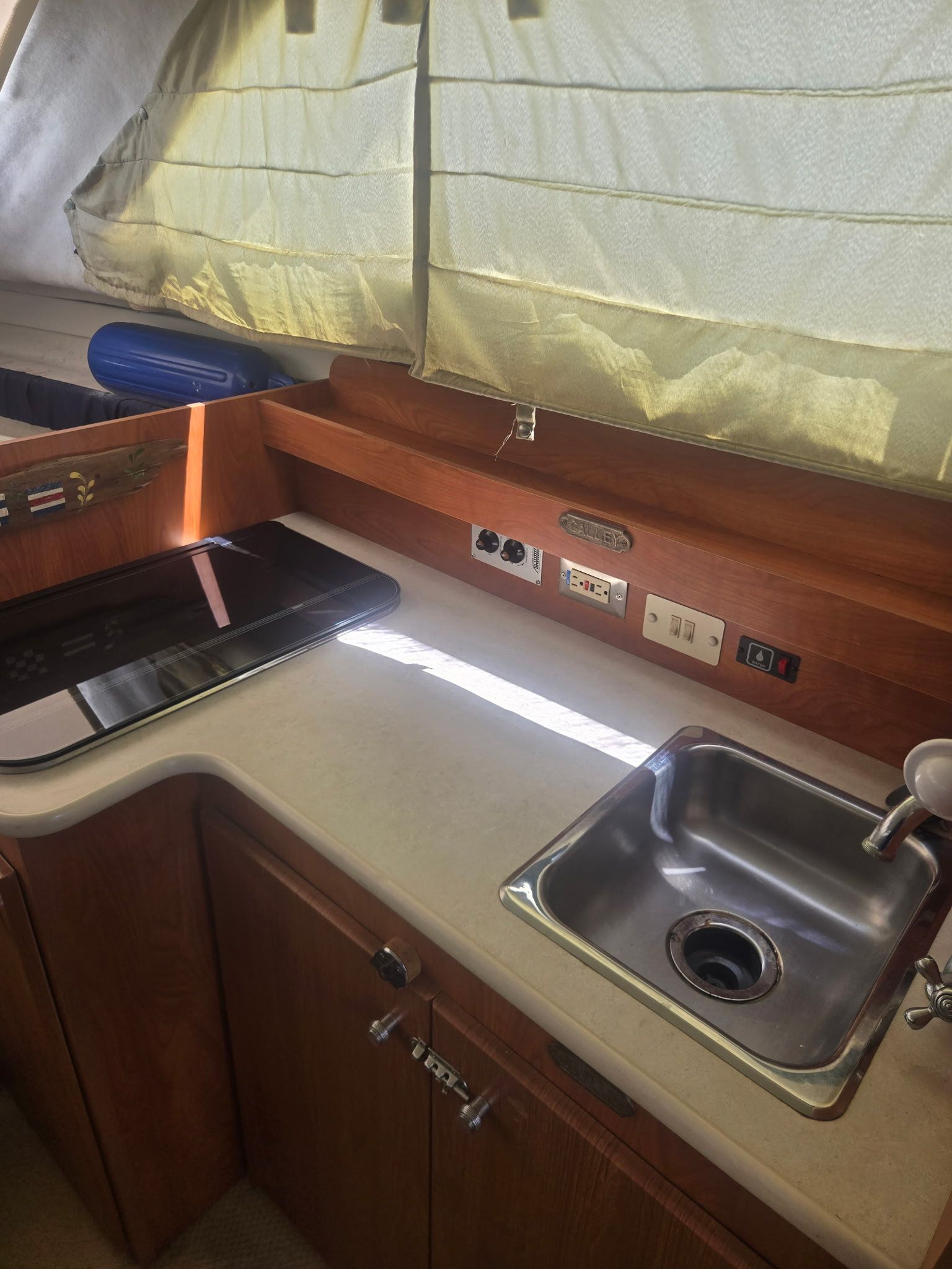 Interior of Bayliner 28 yacht kitchen, 2003 model.