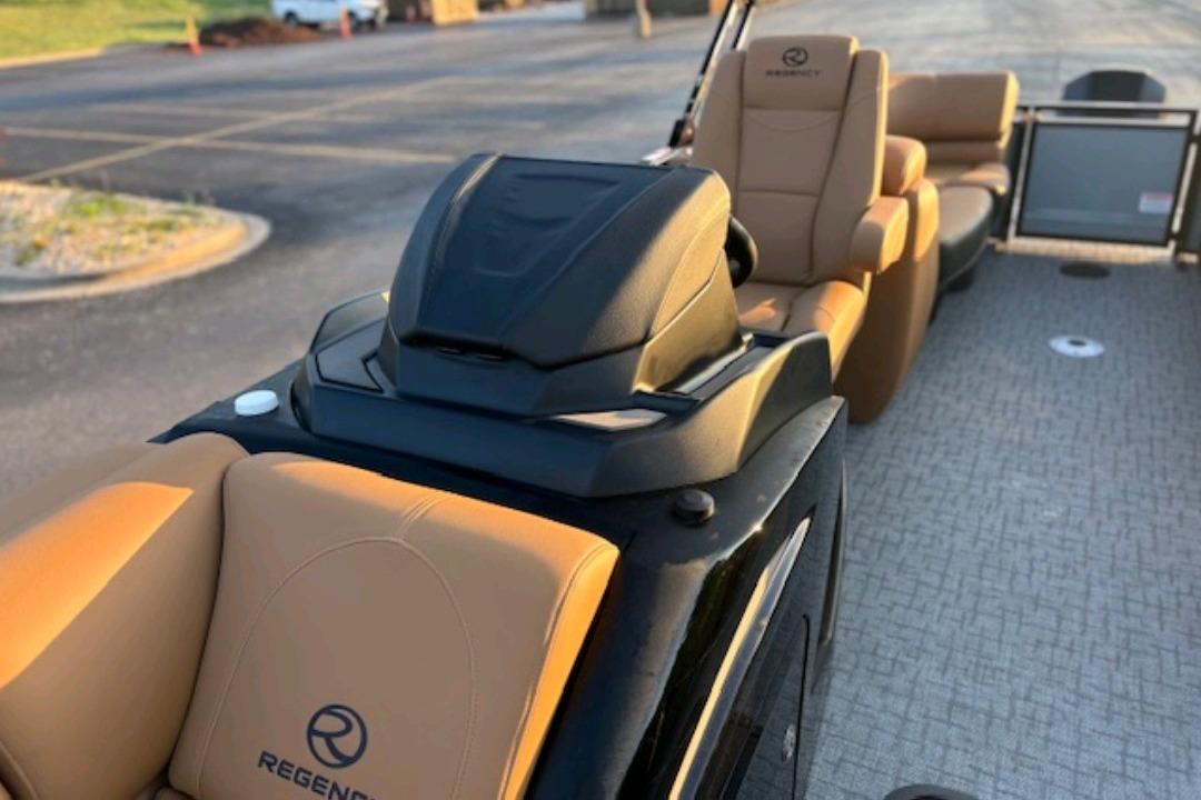 2026 Regency 230 DL boat interior with tan seating and sleek design.