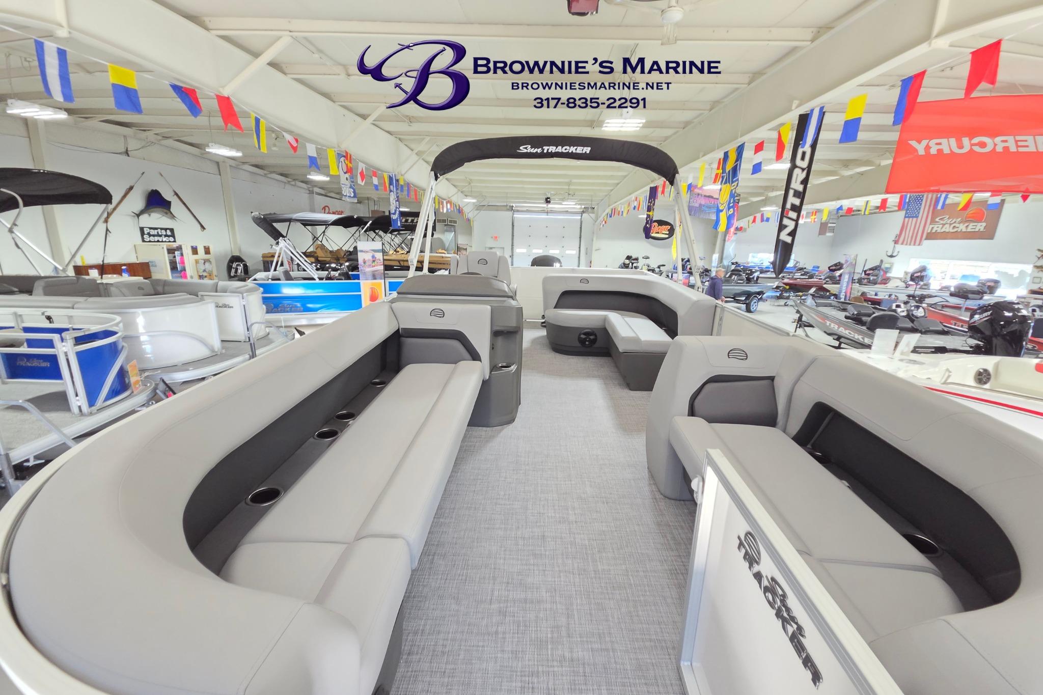 2026 Sun Tracker Party Barge 18 DLX pontoon boat interior at Brownie's Marine showroom.