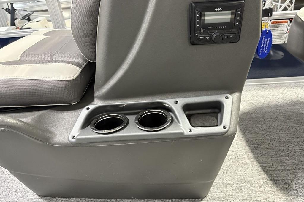 2026 Sun Tracker Bass Buggy 18 DLX boat interior with cup holders and control panel.